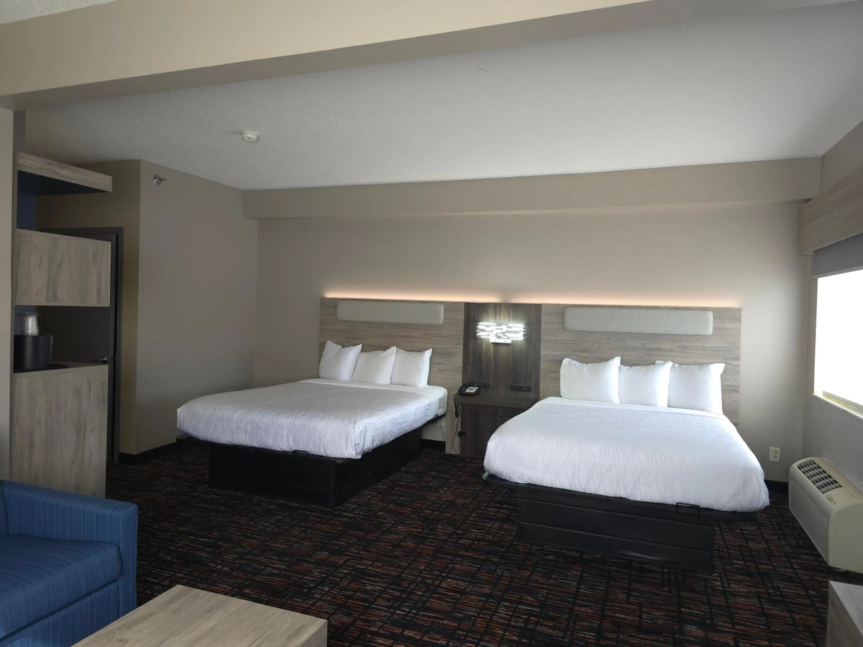 Bed in Reston Inn & Suites