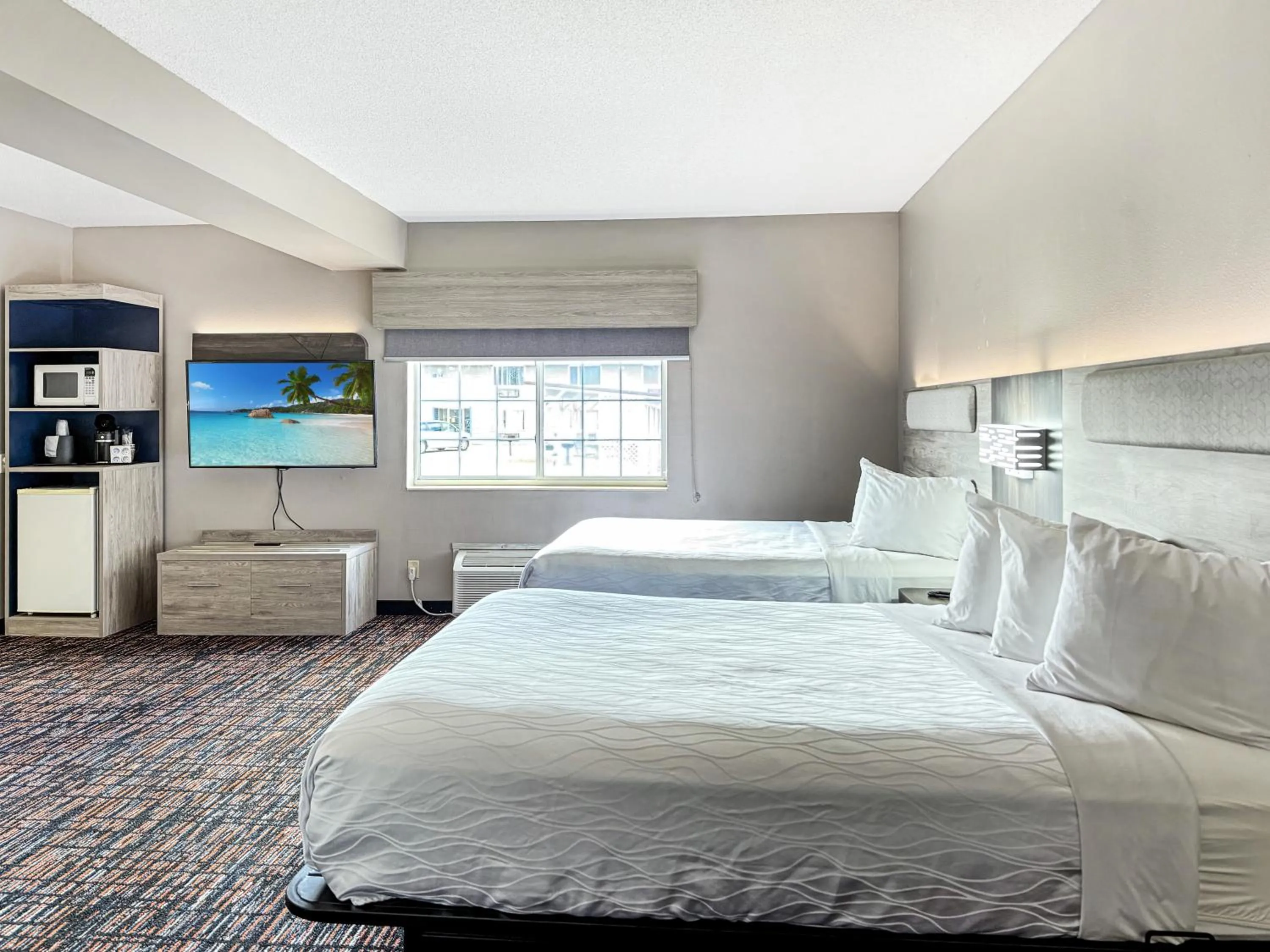 Bed in Reston Inn & Suites