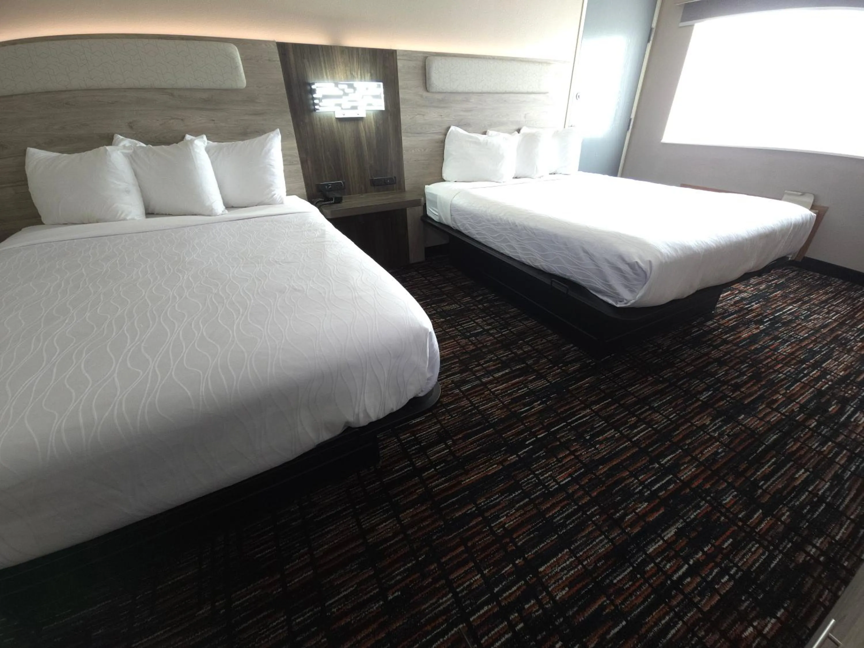 Bed in Reston Inn & Suites