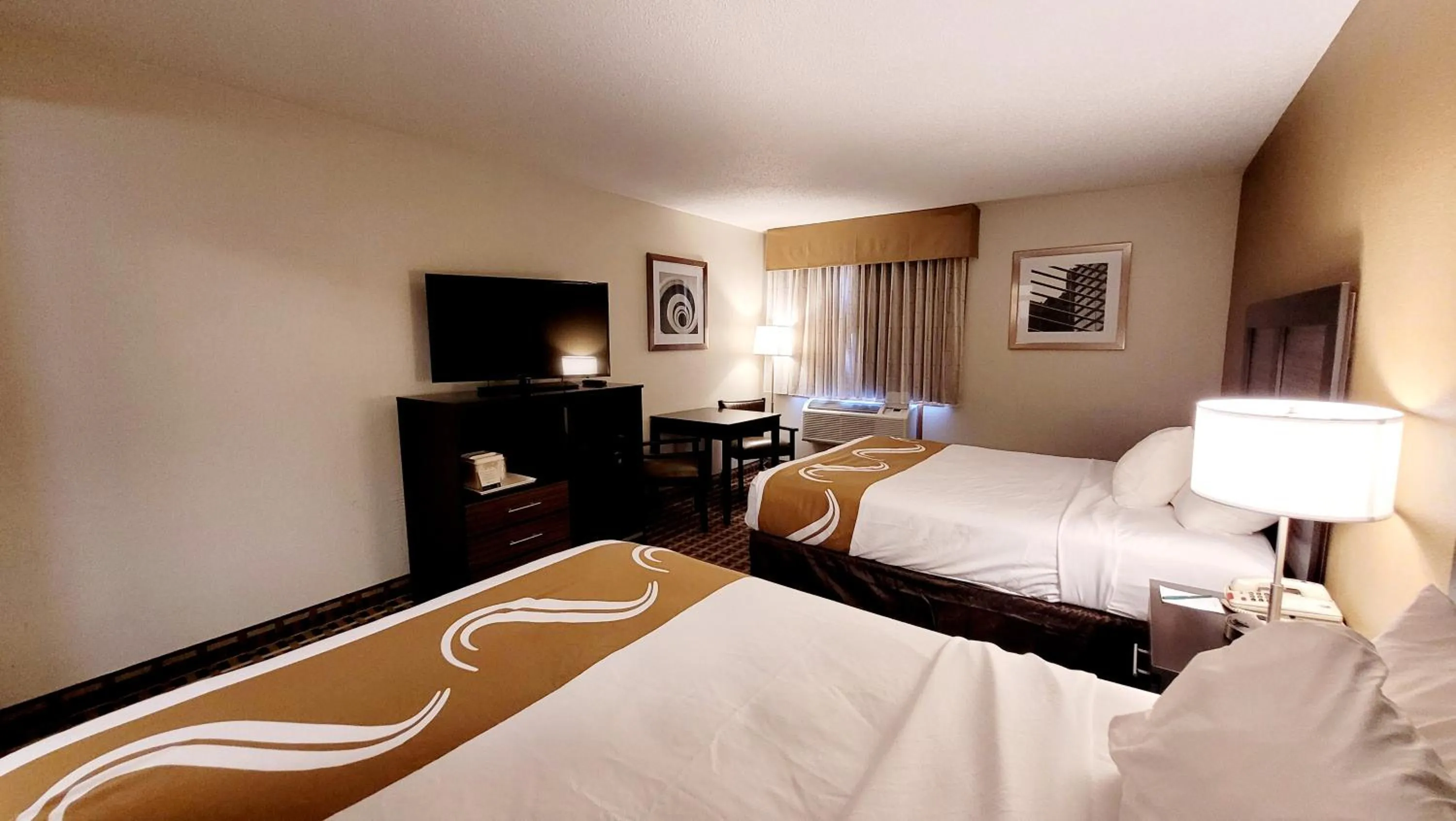 Bed in Quality Inn & Suites