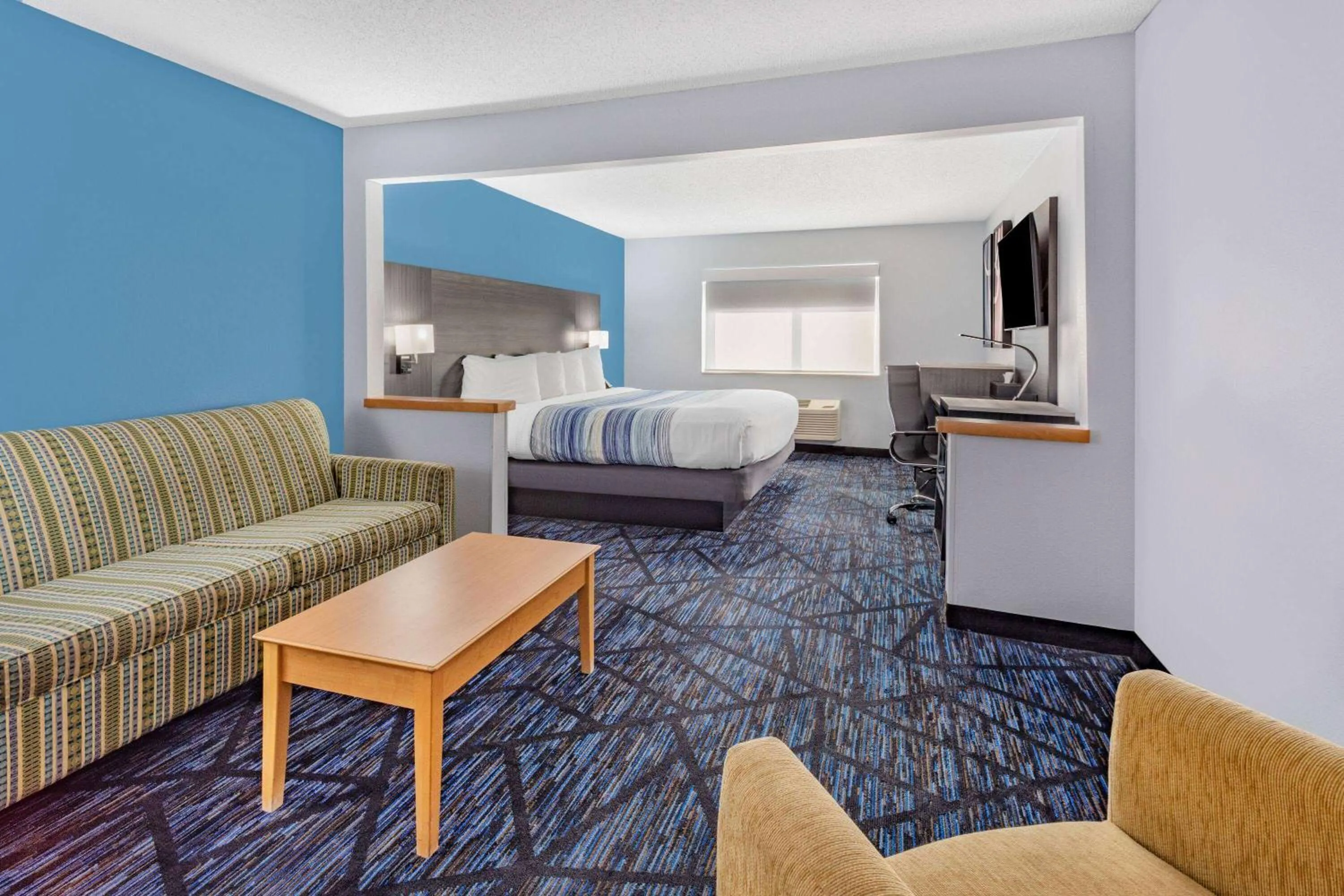 Bed in AmericInn by Wyndham Quincy