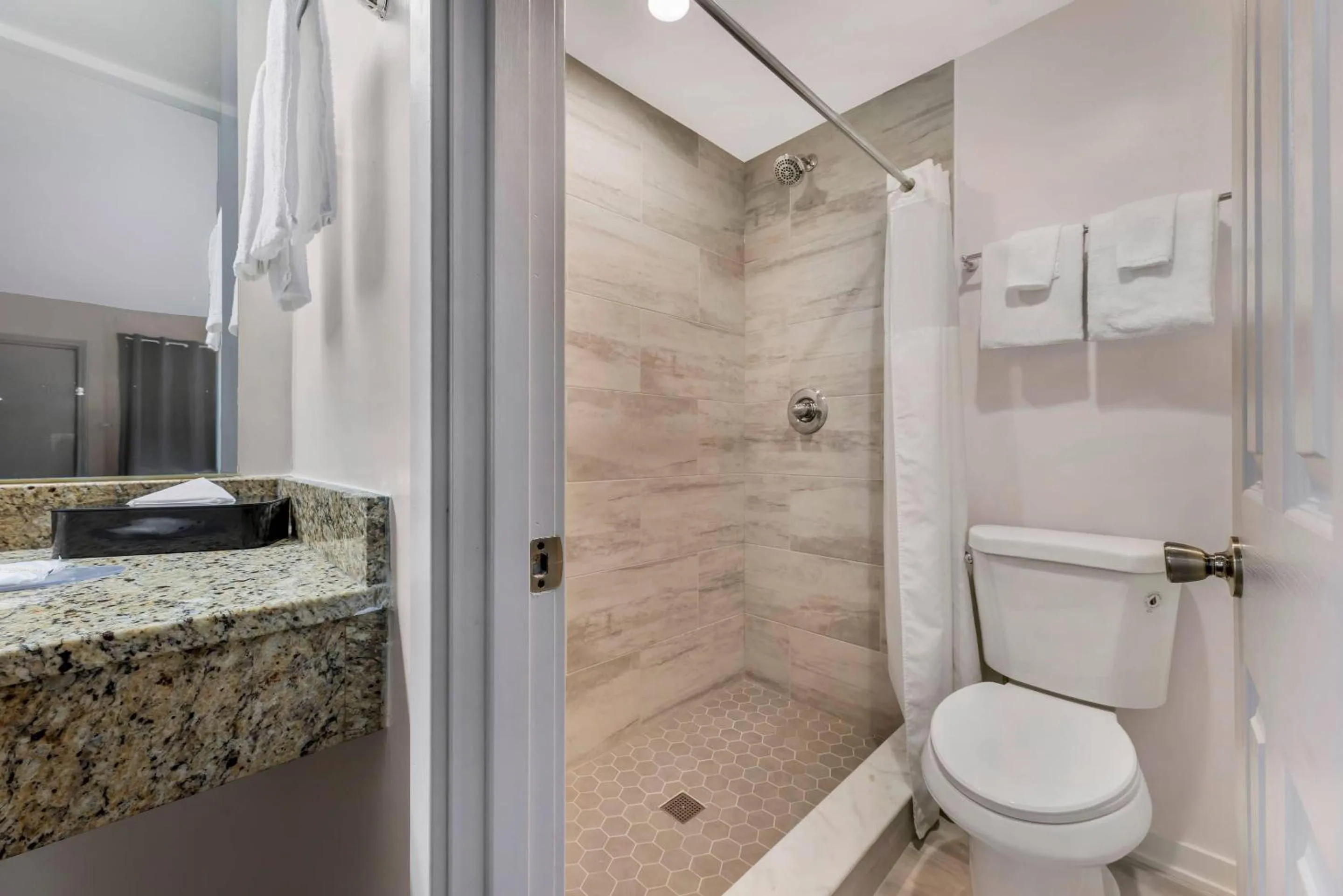 Bedroom in Rodeway Inn Lyons - La Grange