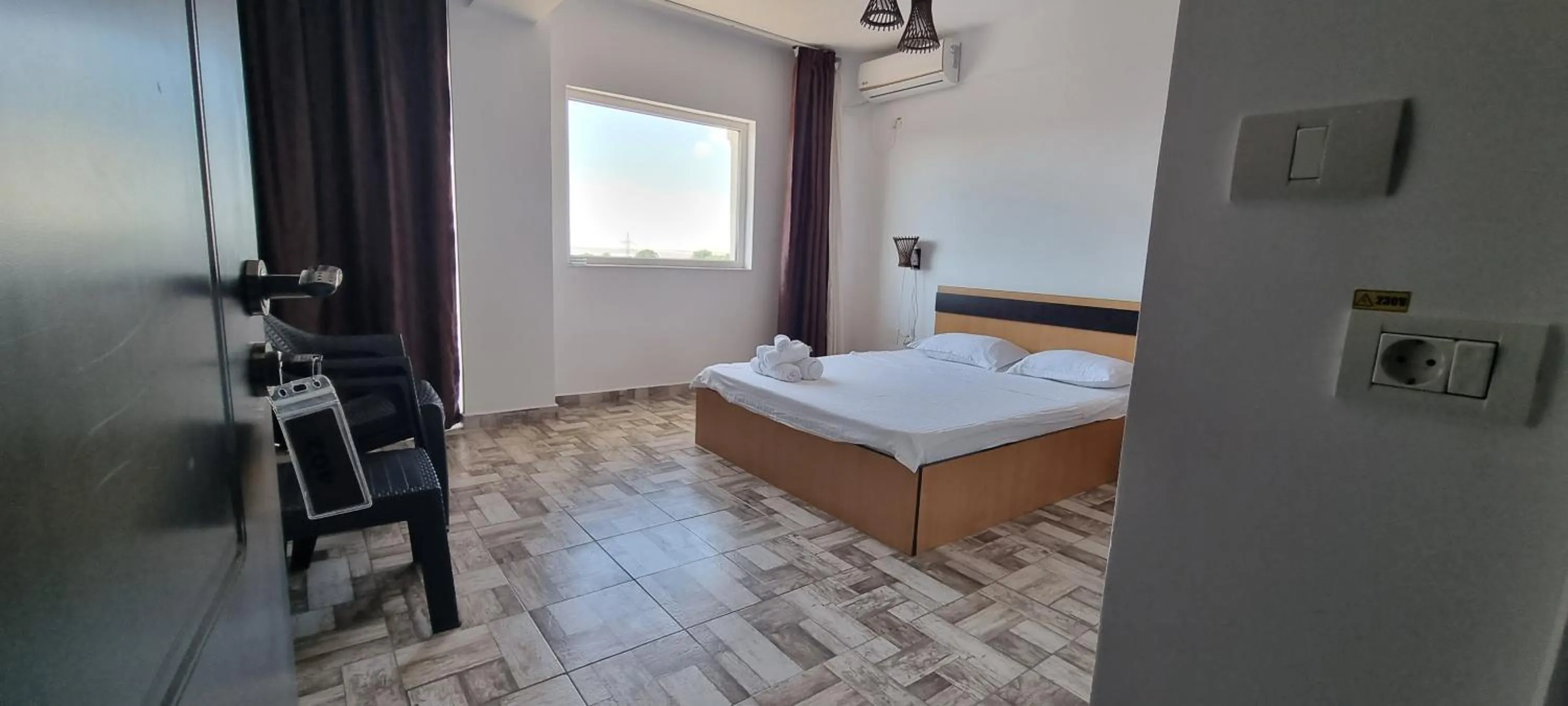 Bed in Hotel Blue Sky Resort