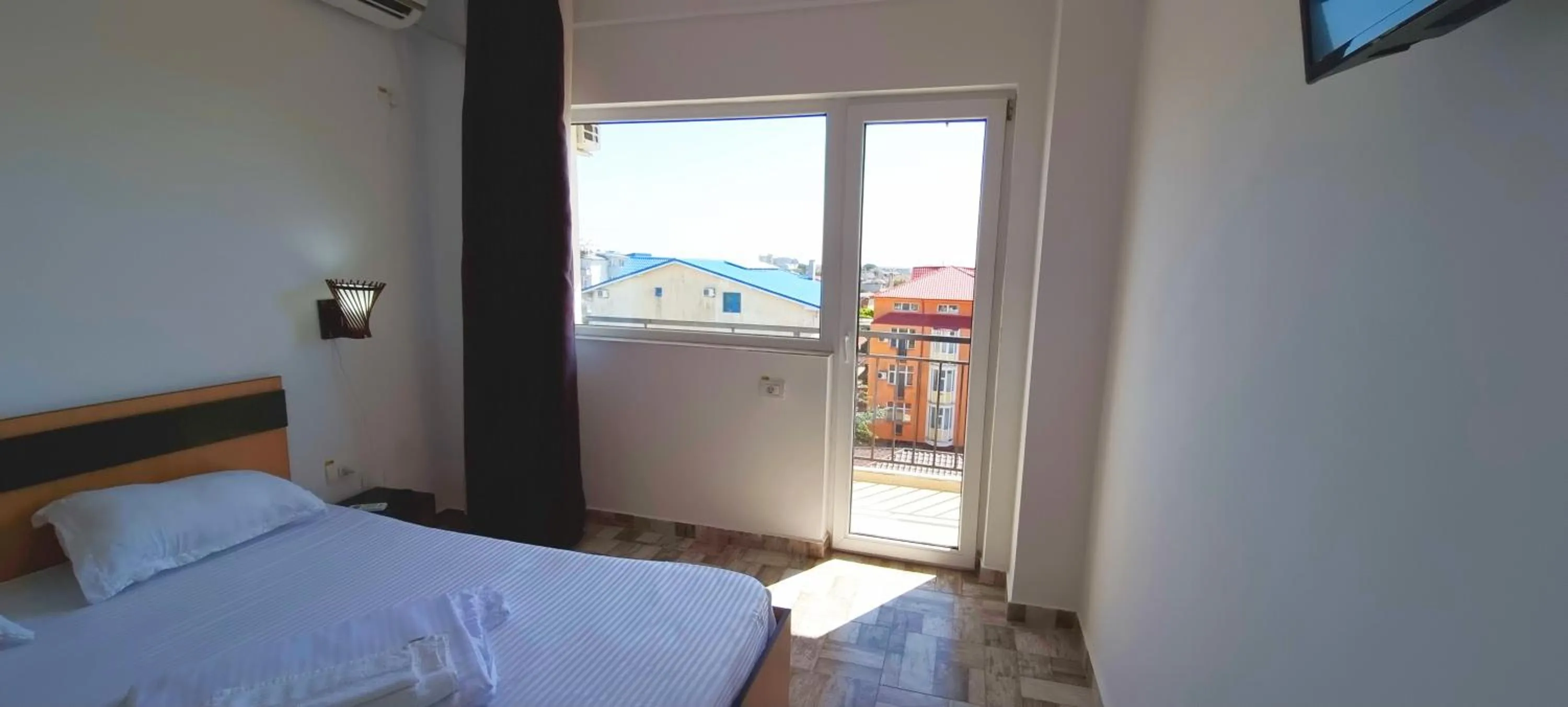 Bed in Hotel Blue Sky Resort