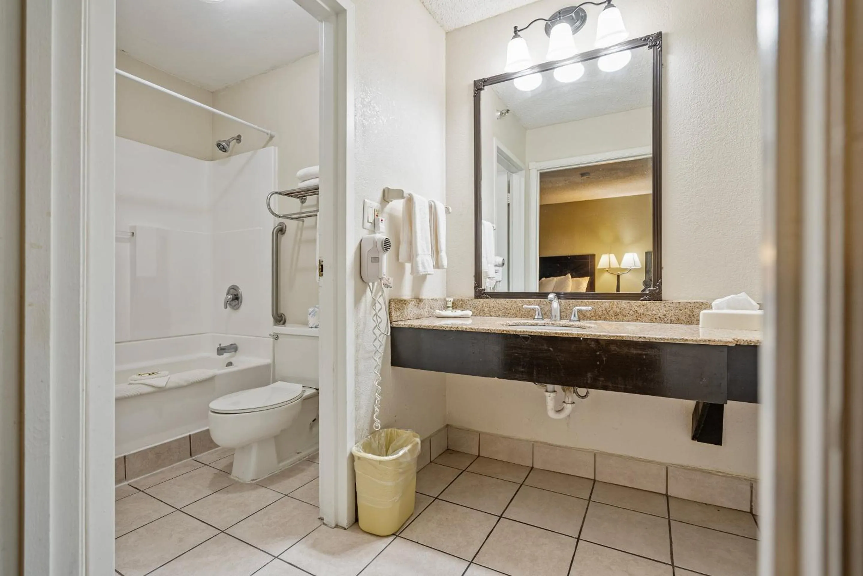 Bathroom in Coratel Plus Suites Wichita West Airport