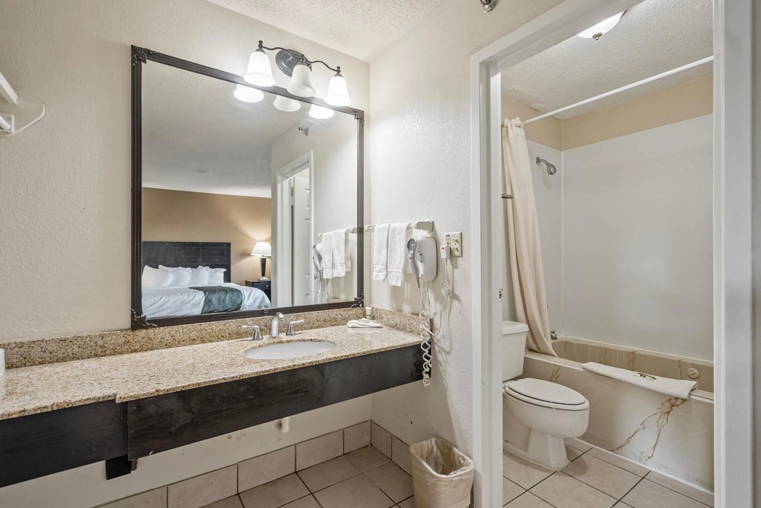 Bathroom in Coratel Plus Suites Wichita West Airport