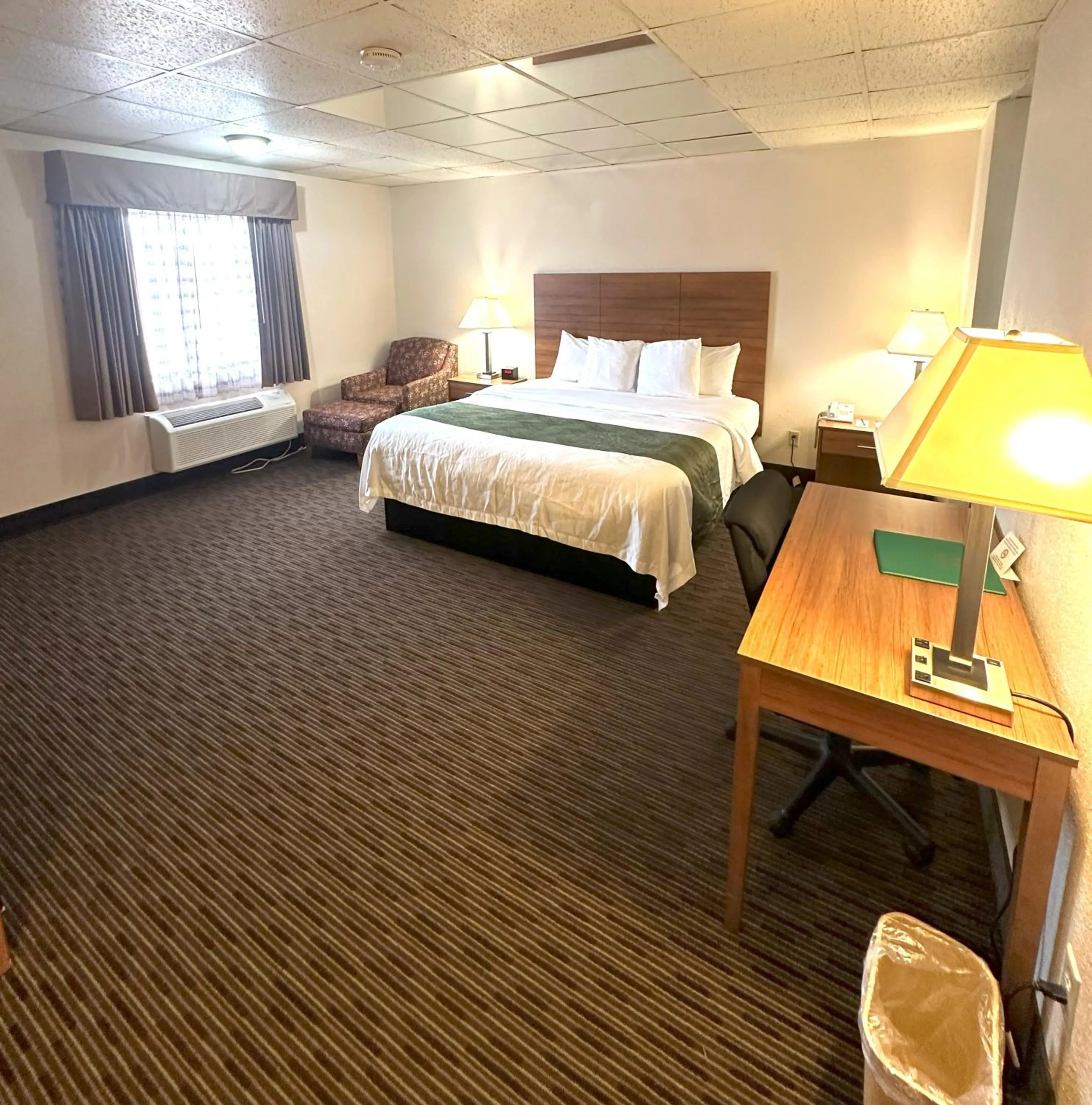 Bed in Sunflower Inn & Suites