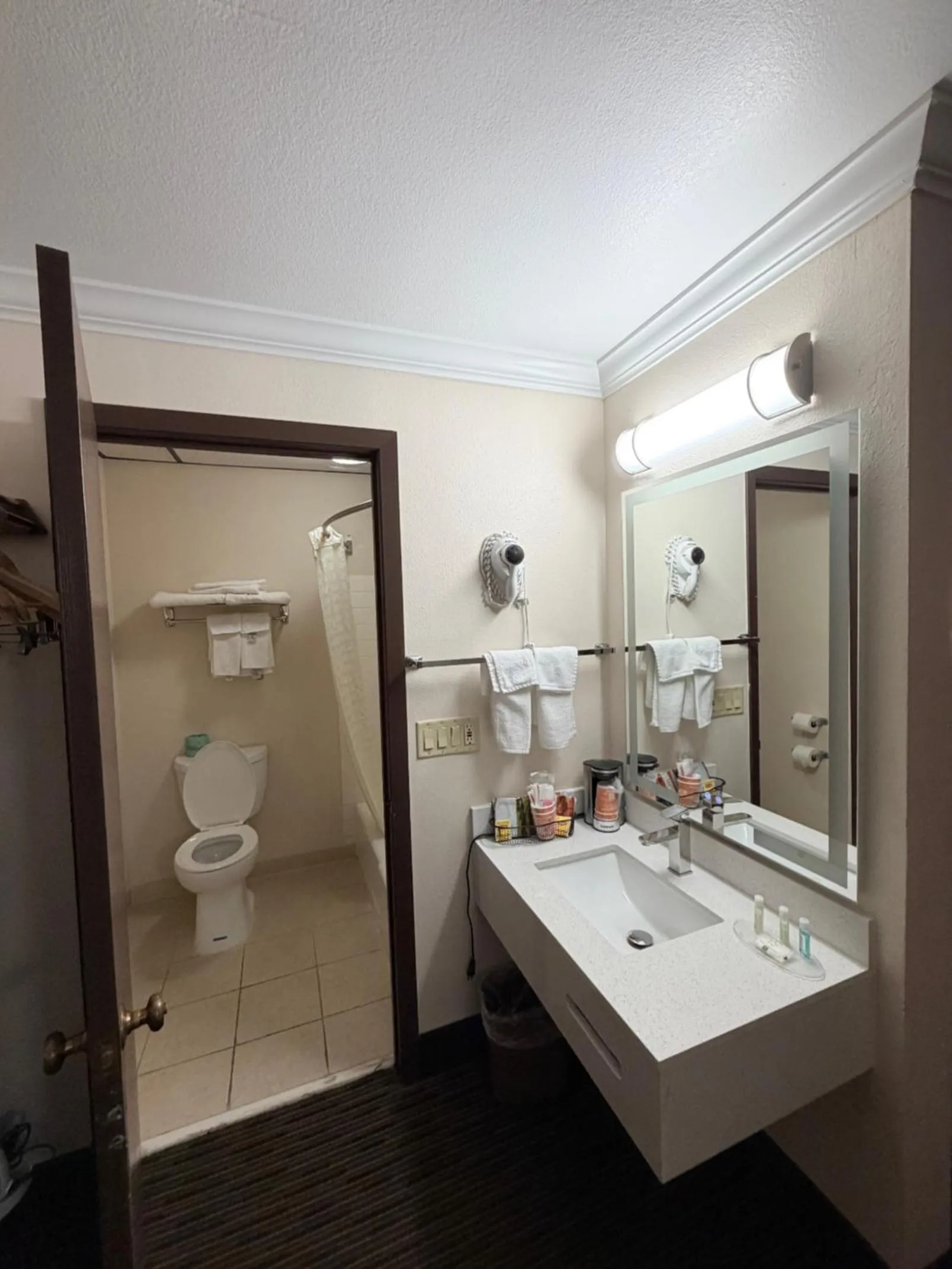 Toilet in Sunflower Inn & Suites