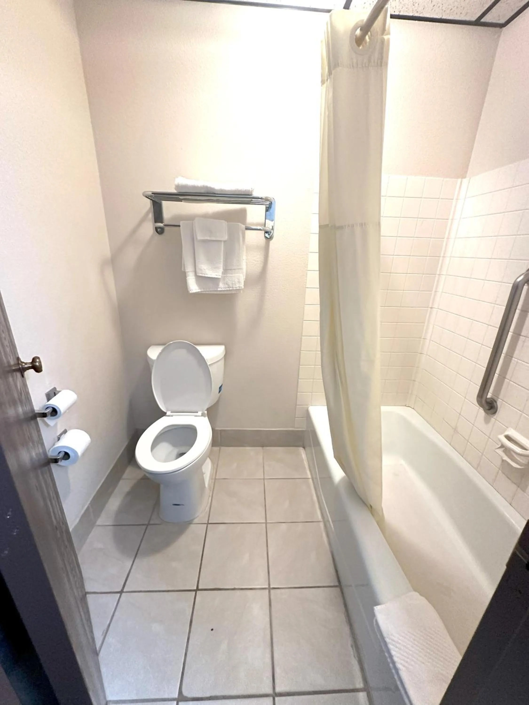 Toilet in Sunflower Inn & Suites