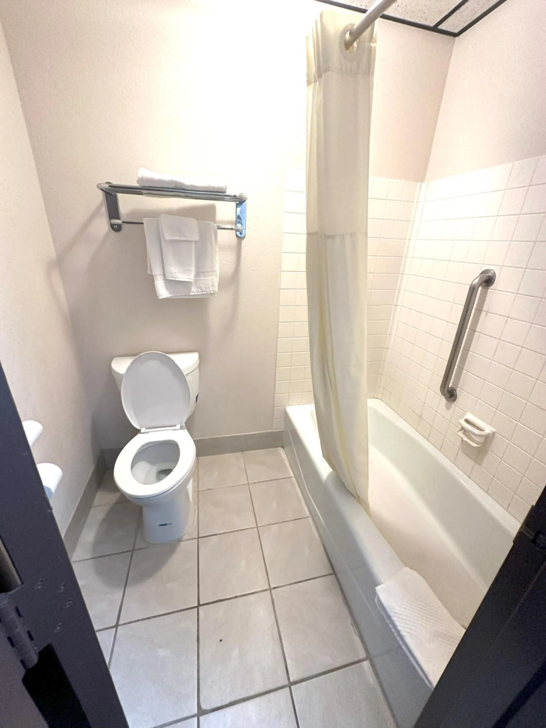 Toilet in Sunflower Inn & Suites
