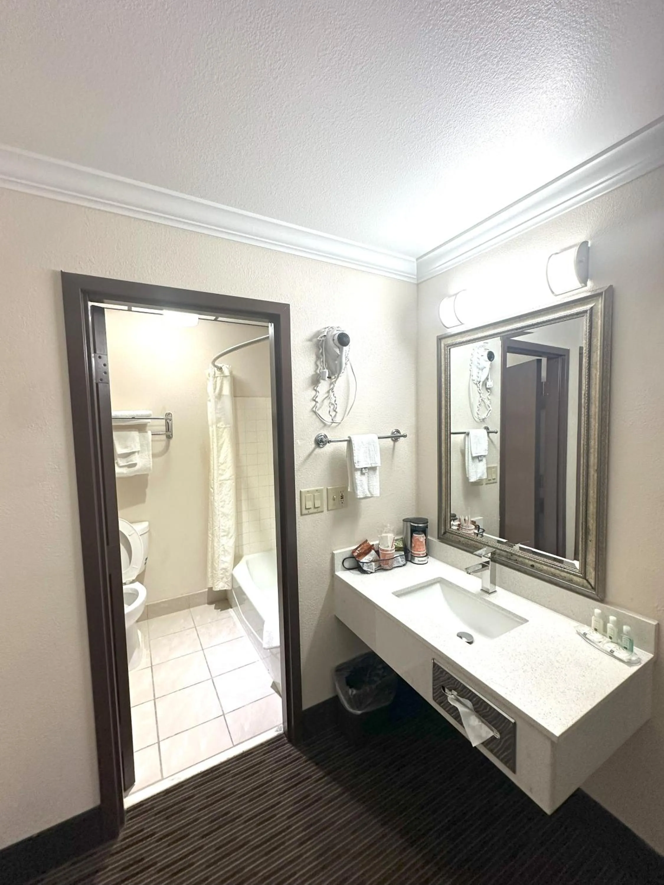 Toilet in Sunflower Inn & Suites