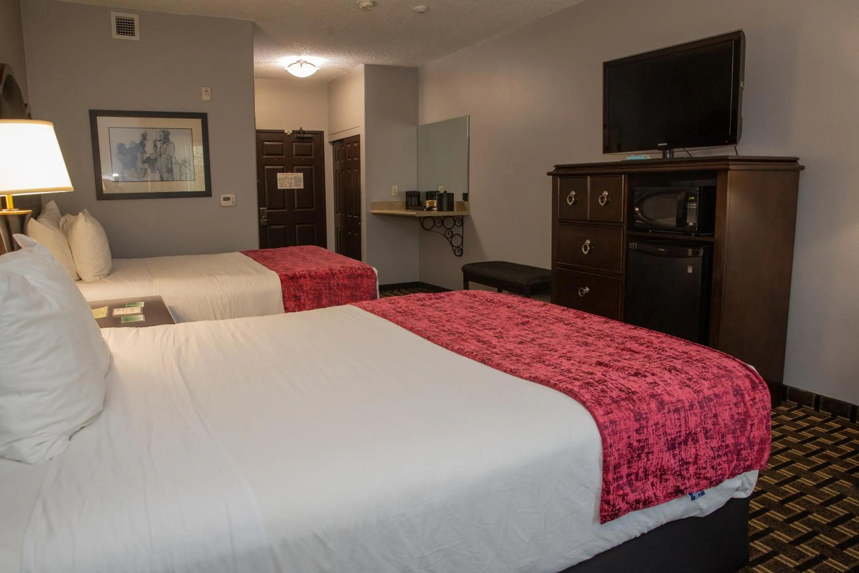 Bed in Evangeline Downs Hotel, an Ascend Collection Hotel