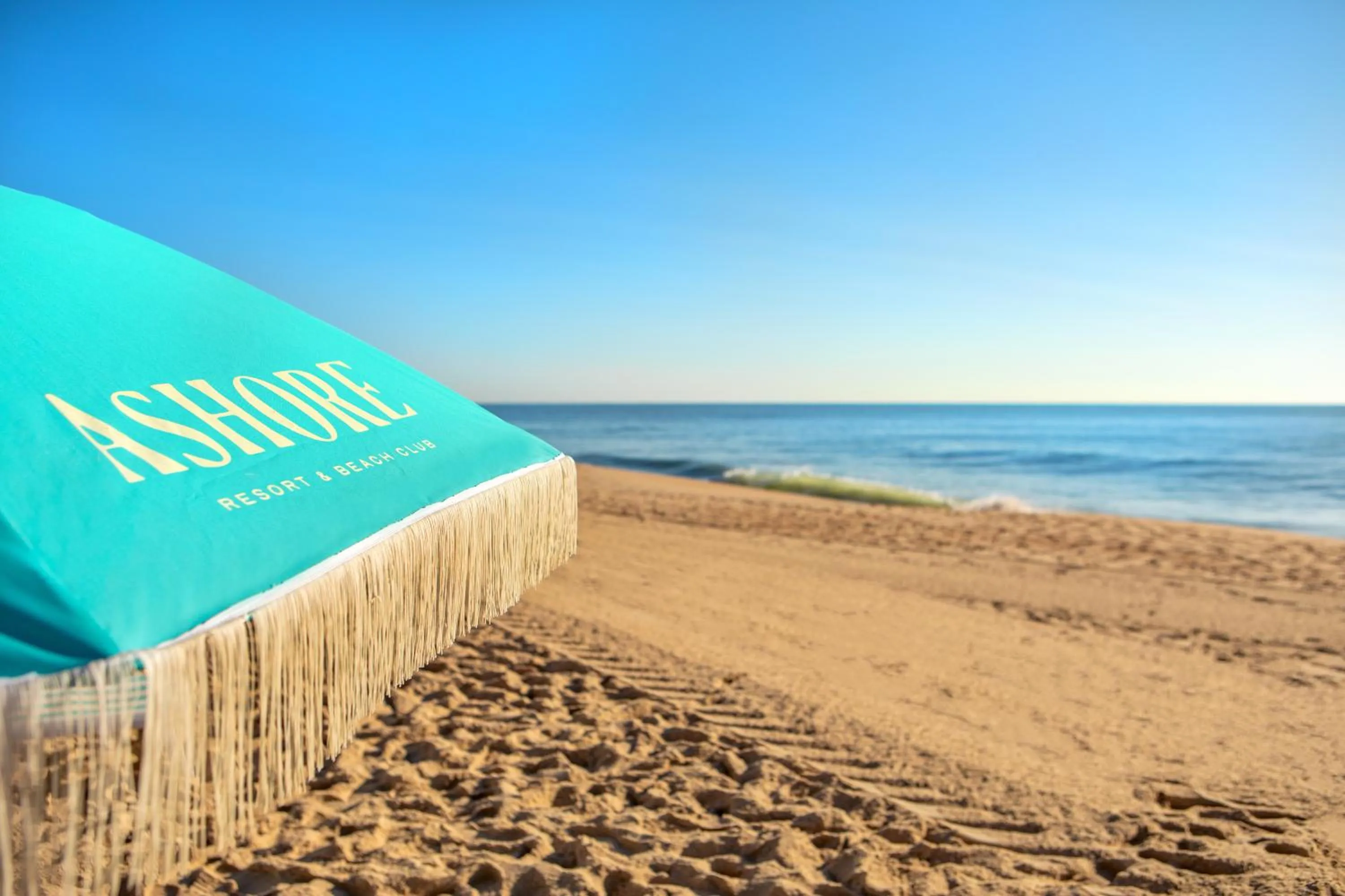 Property logo or sign in Ashore Resort & Beach Club