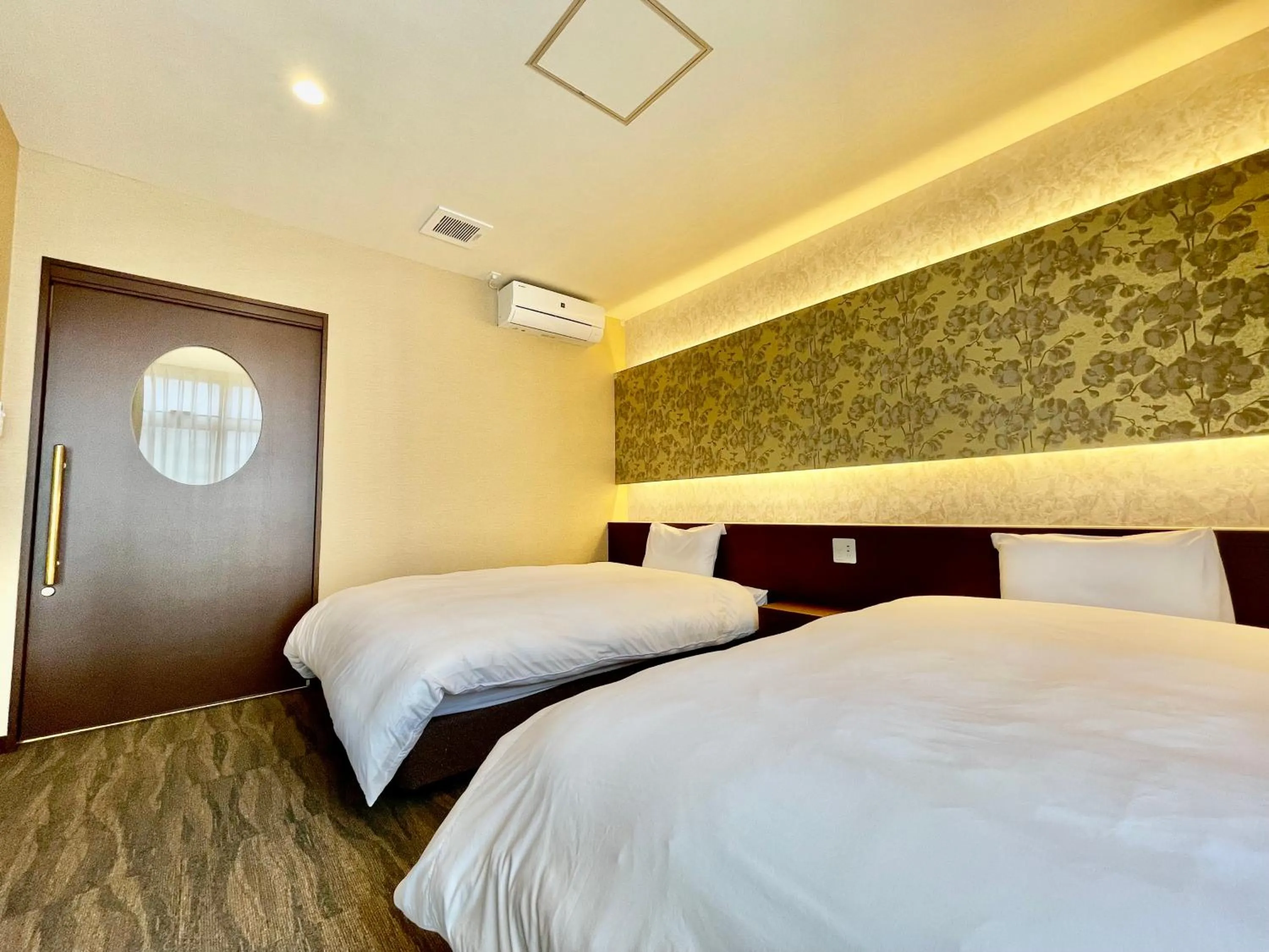 Bed in ホテル天使館 久茂地 -Tenshi-Kan-