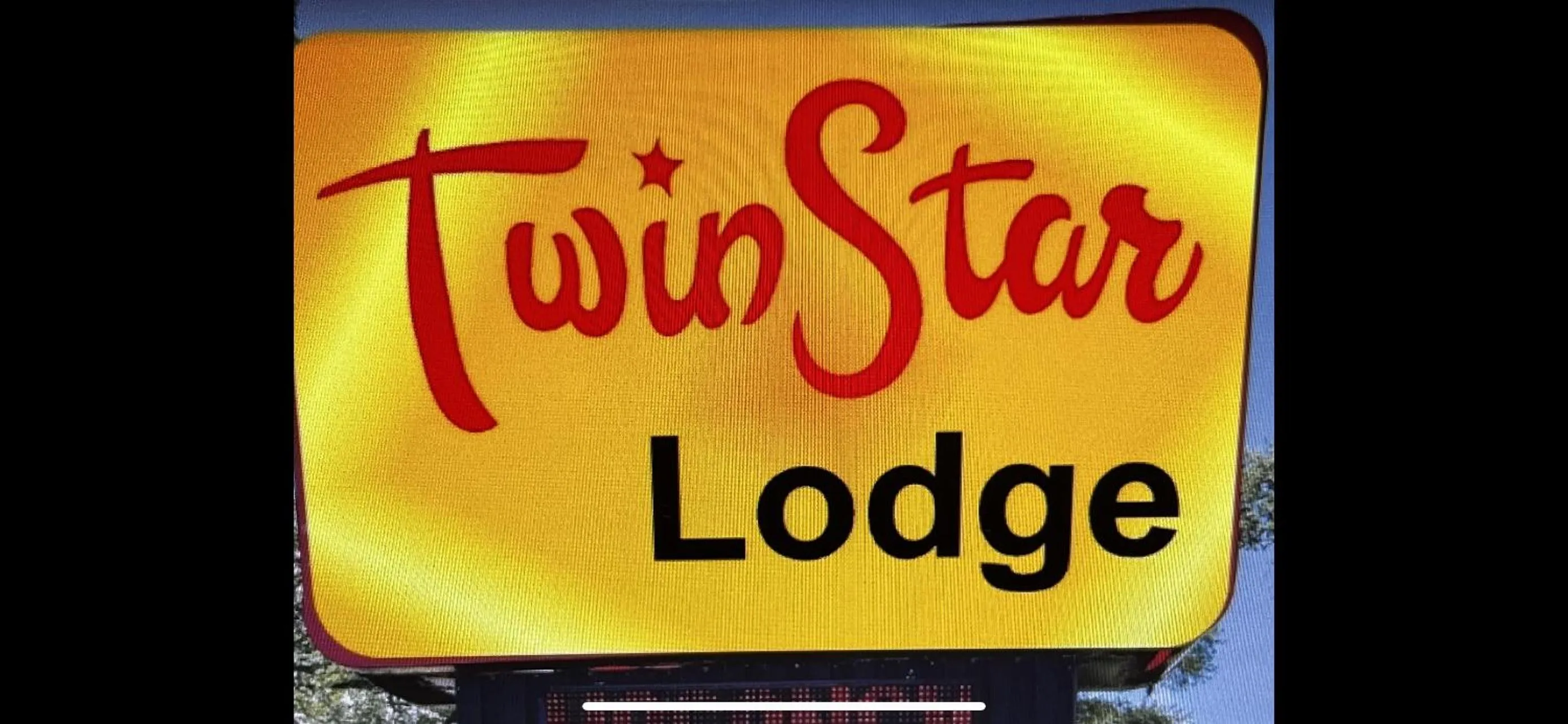 Property logo or sign in Twin Star Lodge