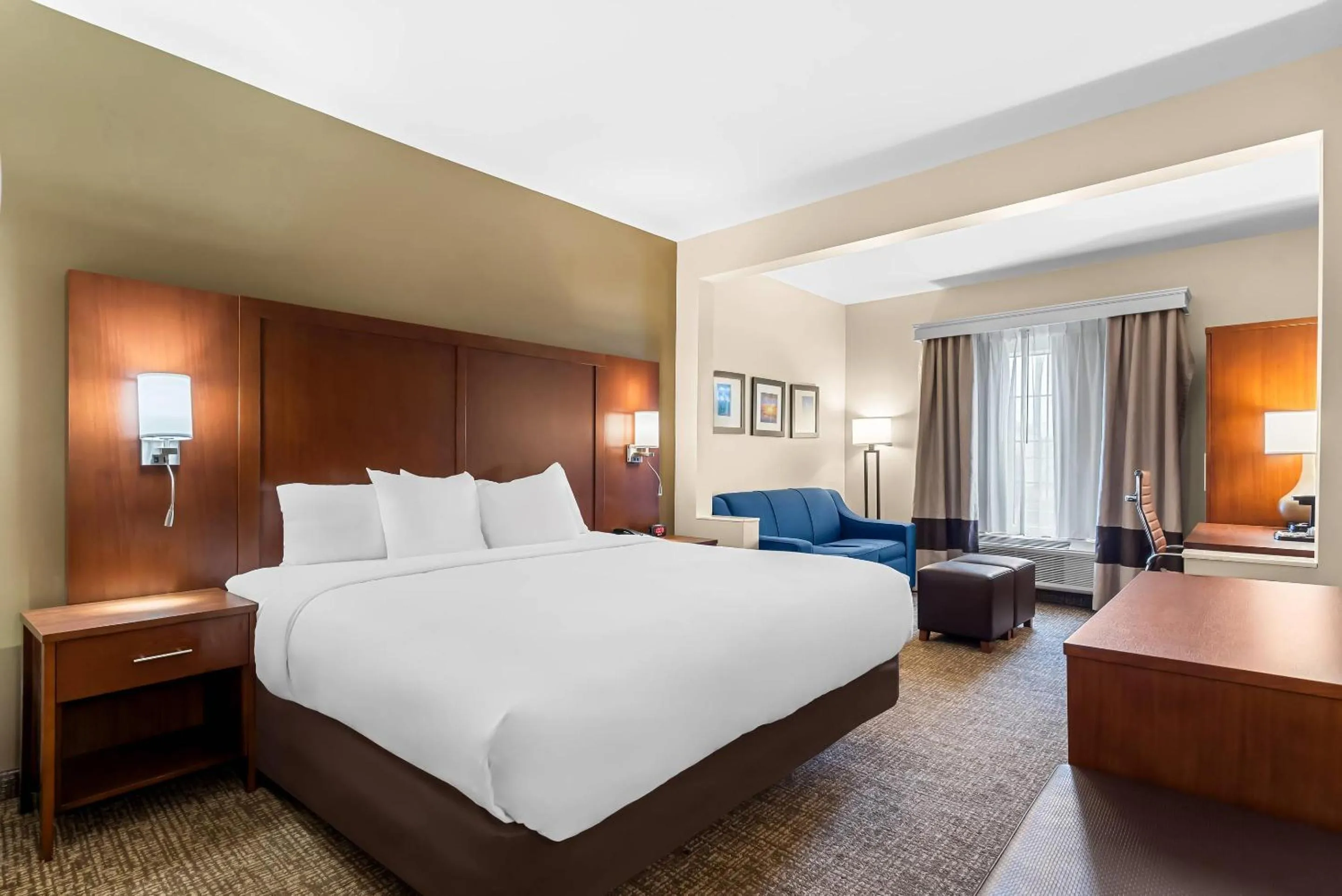 Seating area, Bed in Comfort Suites near Camp Lejeune