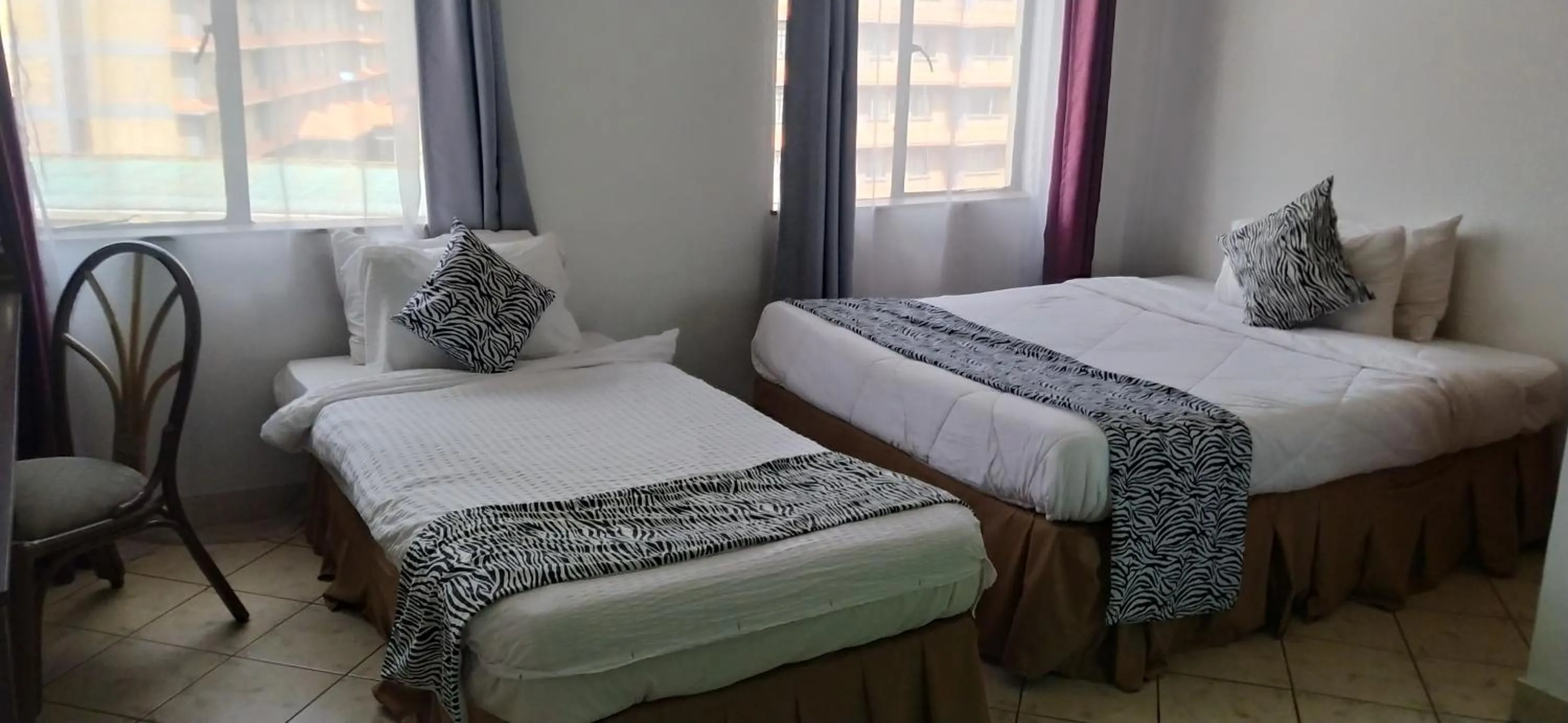 Bed in Plus254 Hotel
