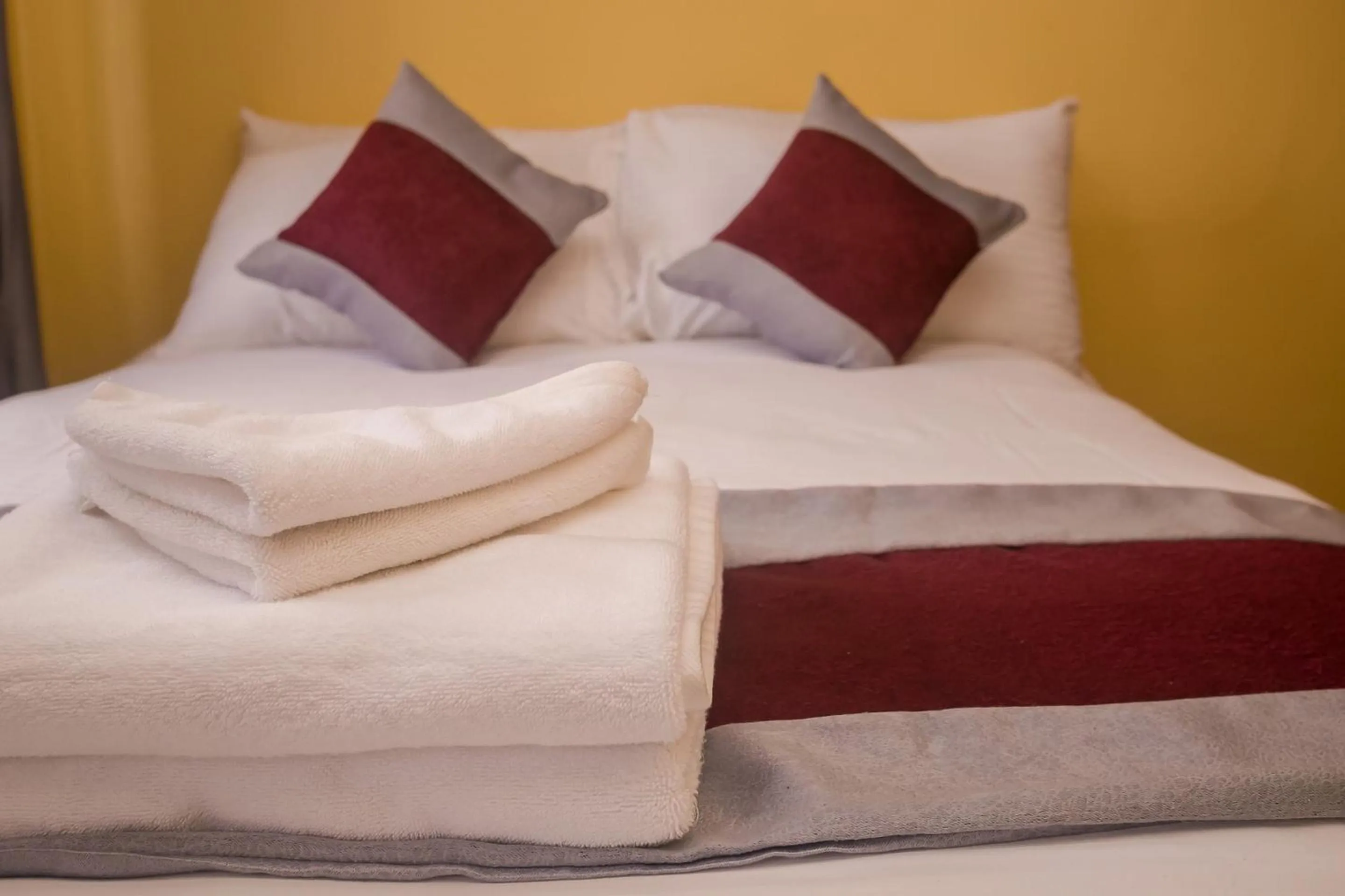 Bed in Plus254 Hotel