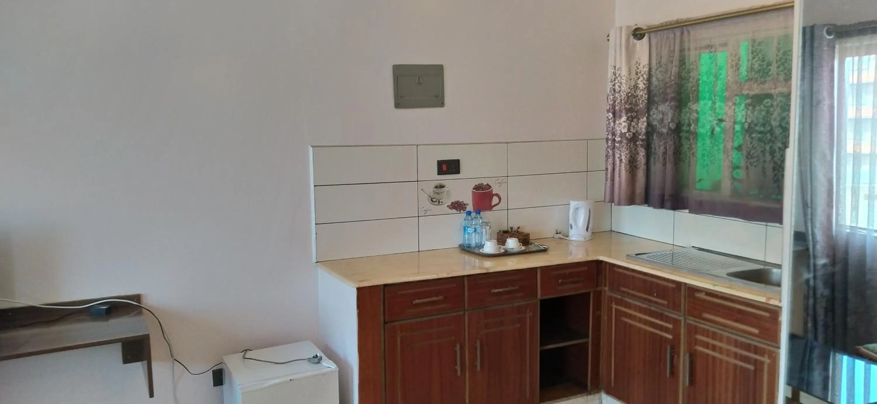 Kitchen or kitchenette in Plus254 Hotel
