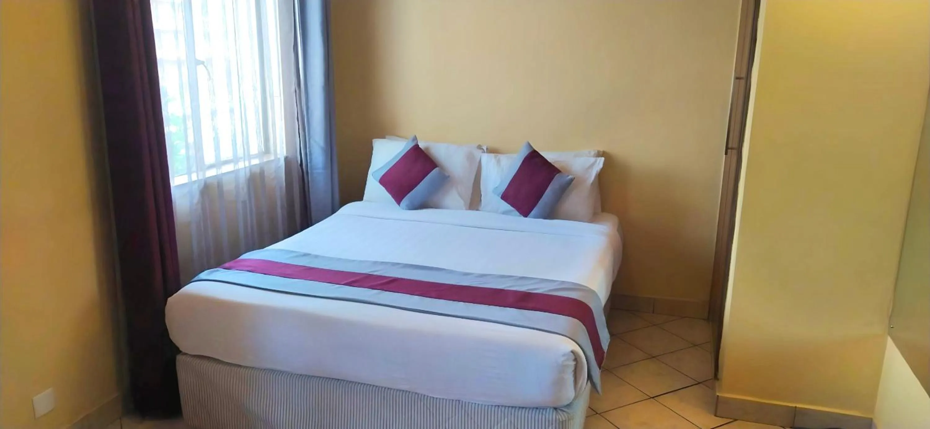 Bed in Plus254 Hotel