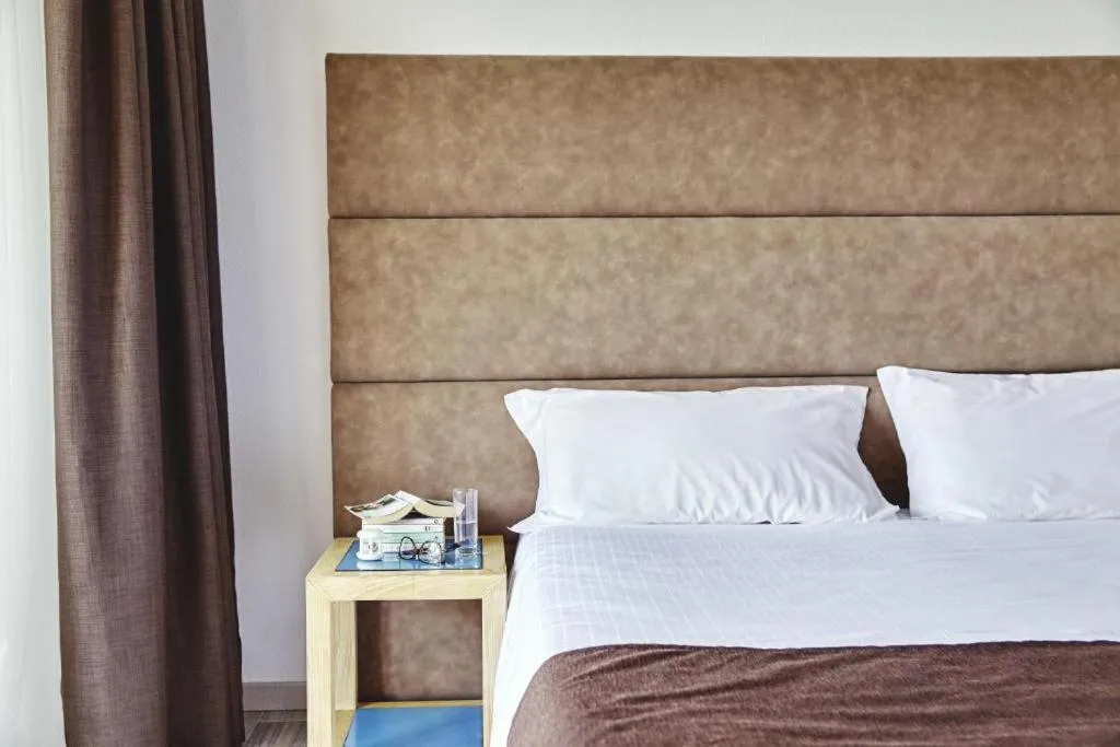 Bed in Baia di Conte Resort