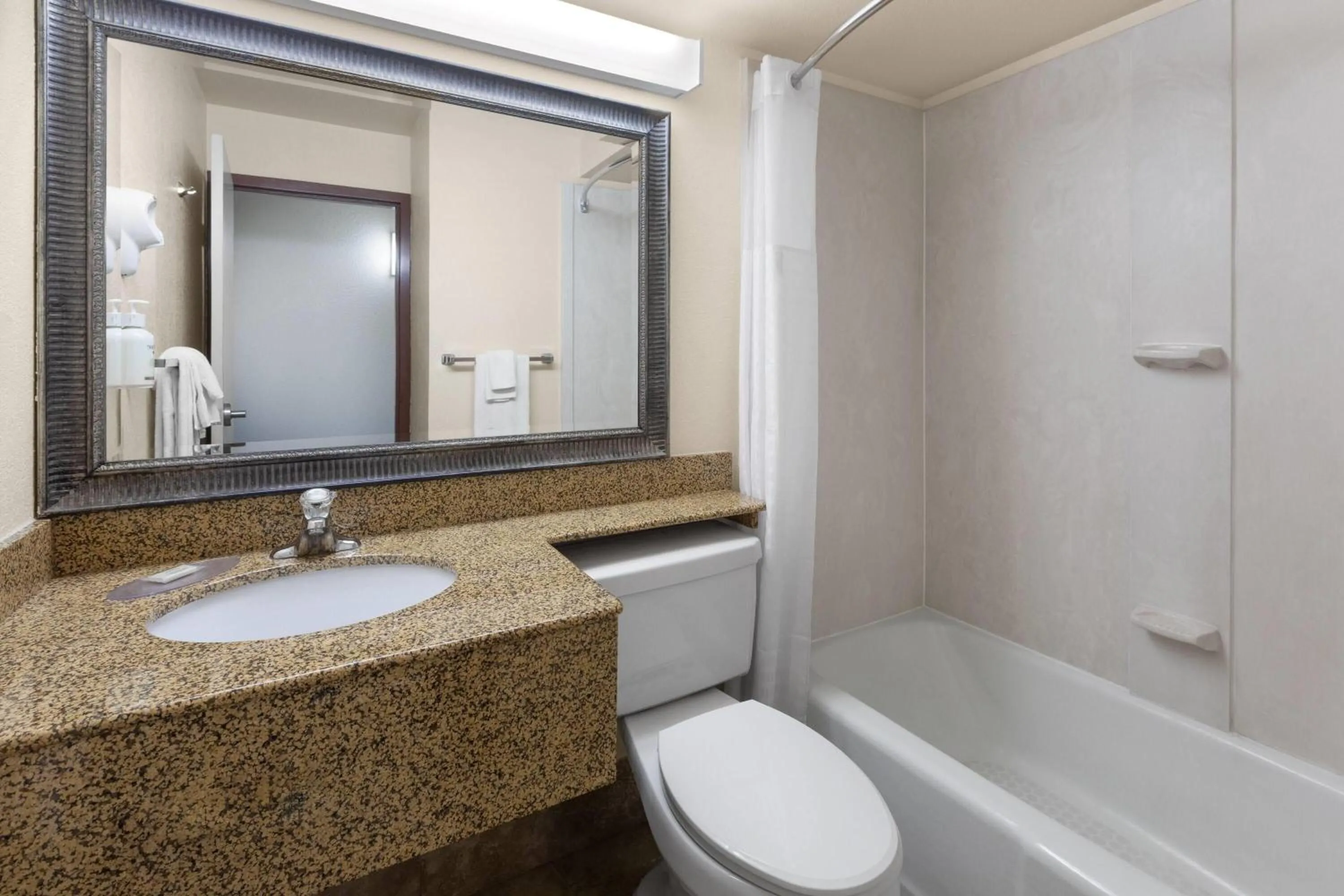 Bathroom in Baymont by Wyndham Jamestown Conference Center & Water Park