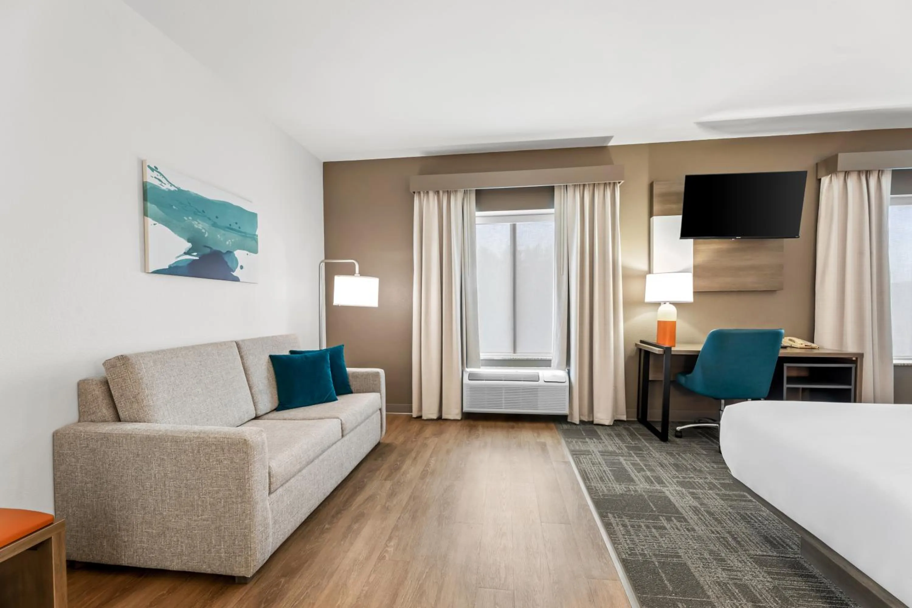 Communal lounge/ TV room, Bed in Comfort Suites Gothenburg South