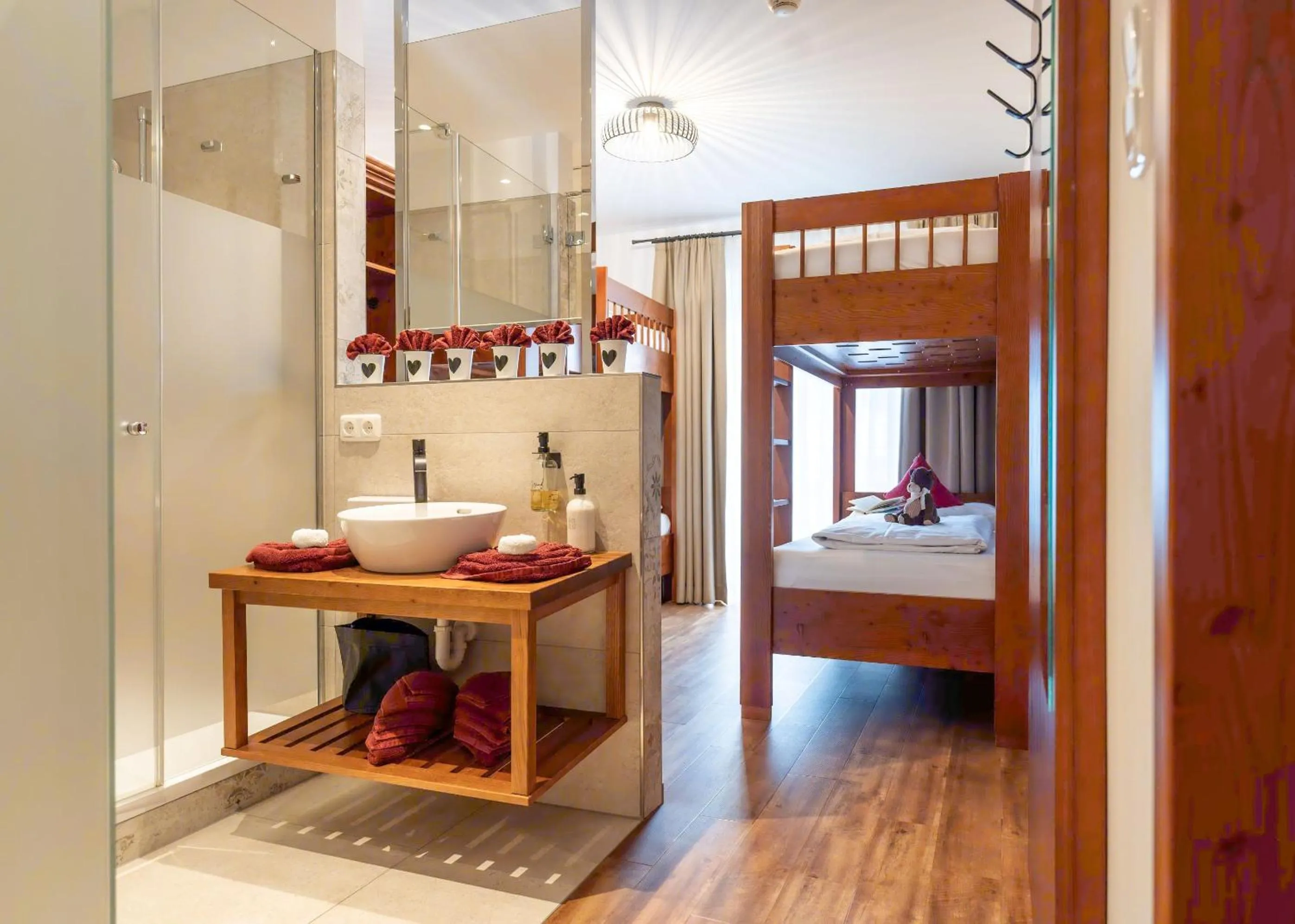 Bathroom, Bed in Hotel Krone Tirol