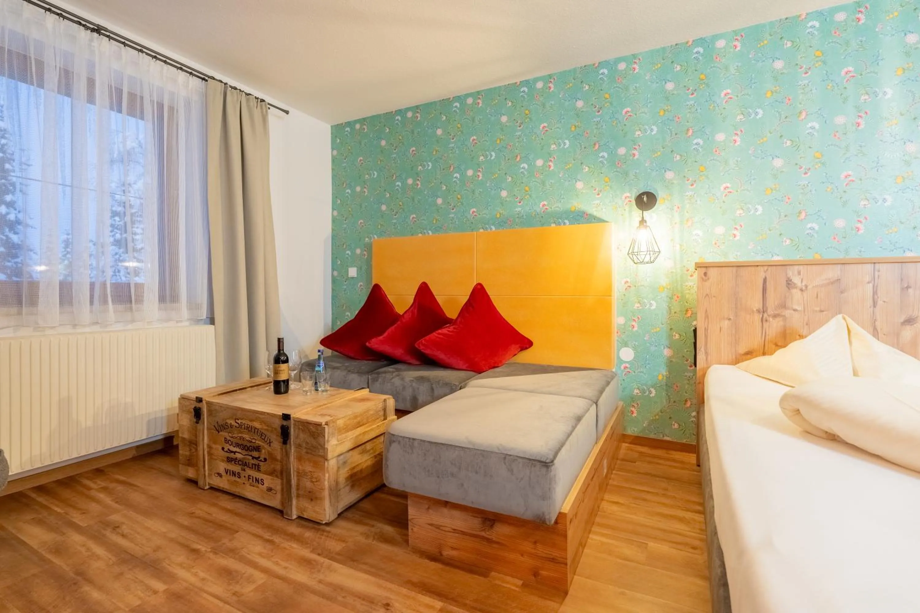 Seating area, Bed in Hotel Krone Tirol