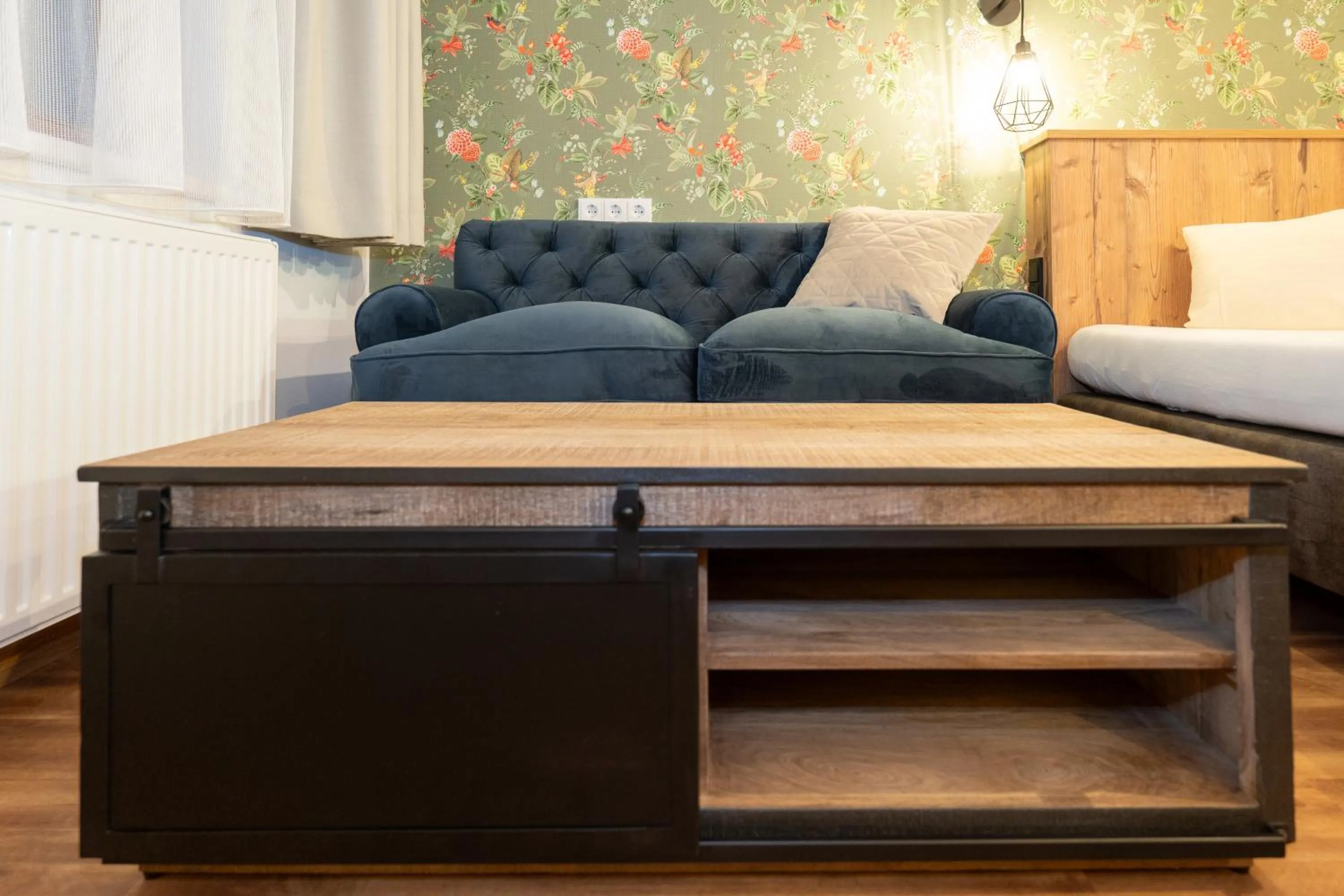 Seating area, Bed in Hotel Krone Tirol