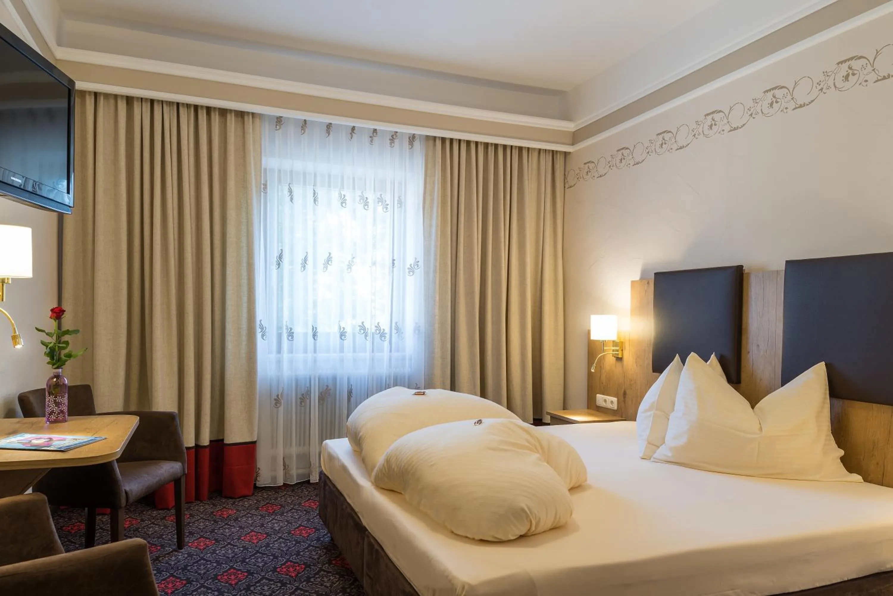 Bed in Hotel Krone Tirol