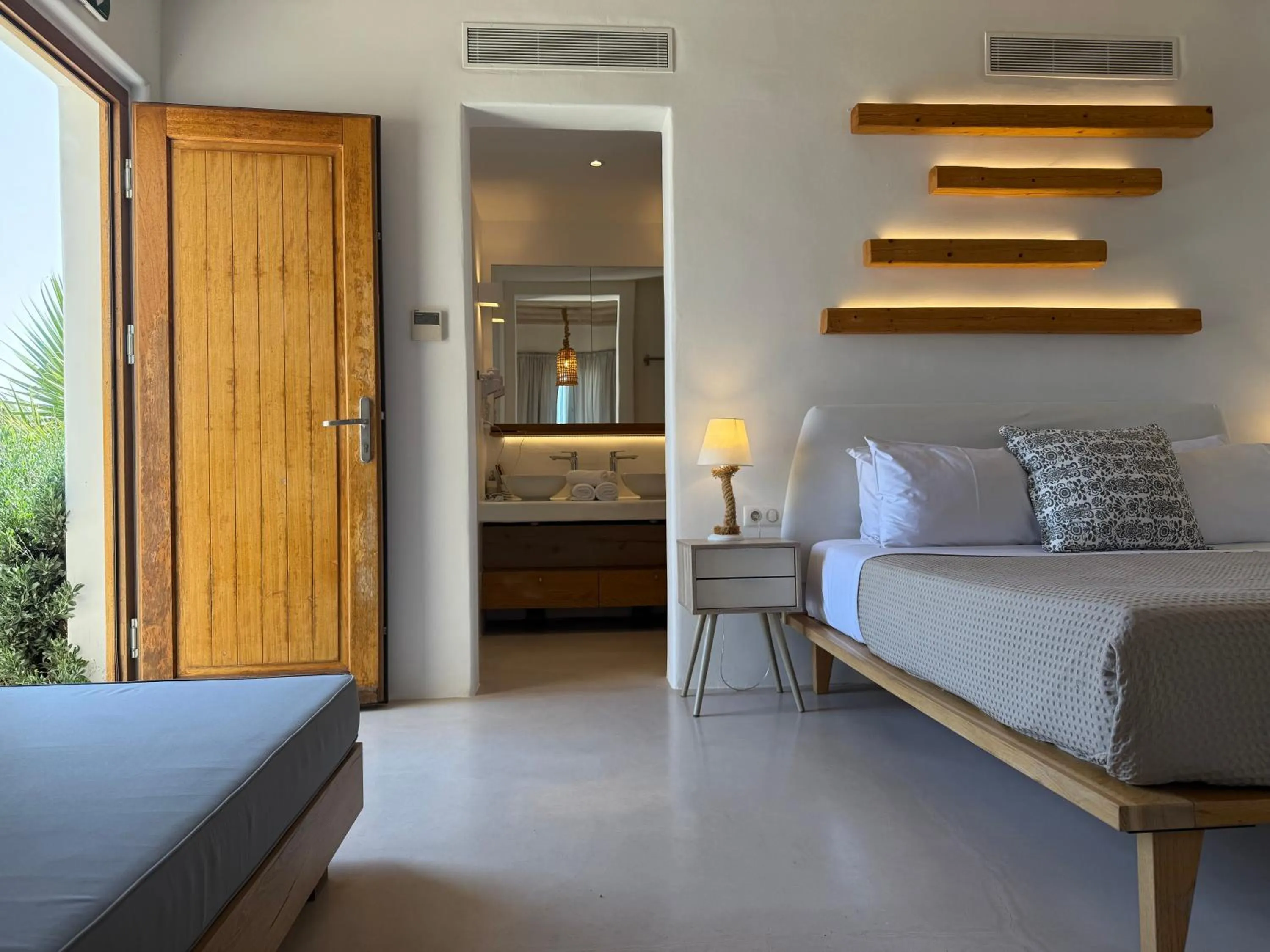 Bed in Myconian Crown Suites