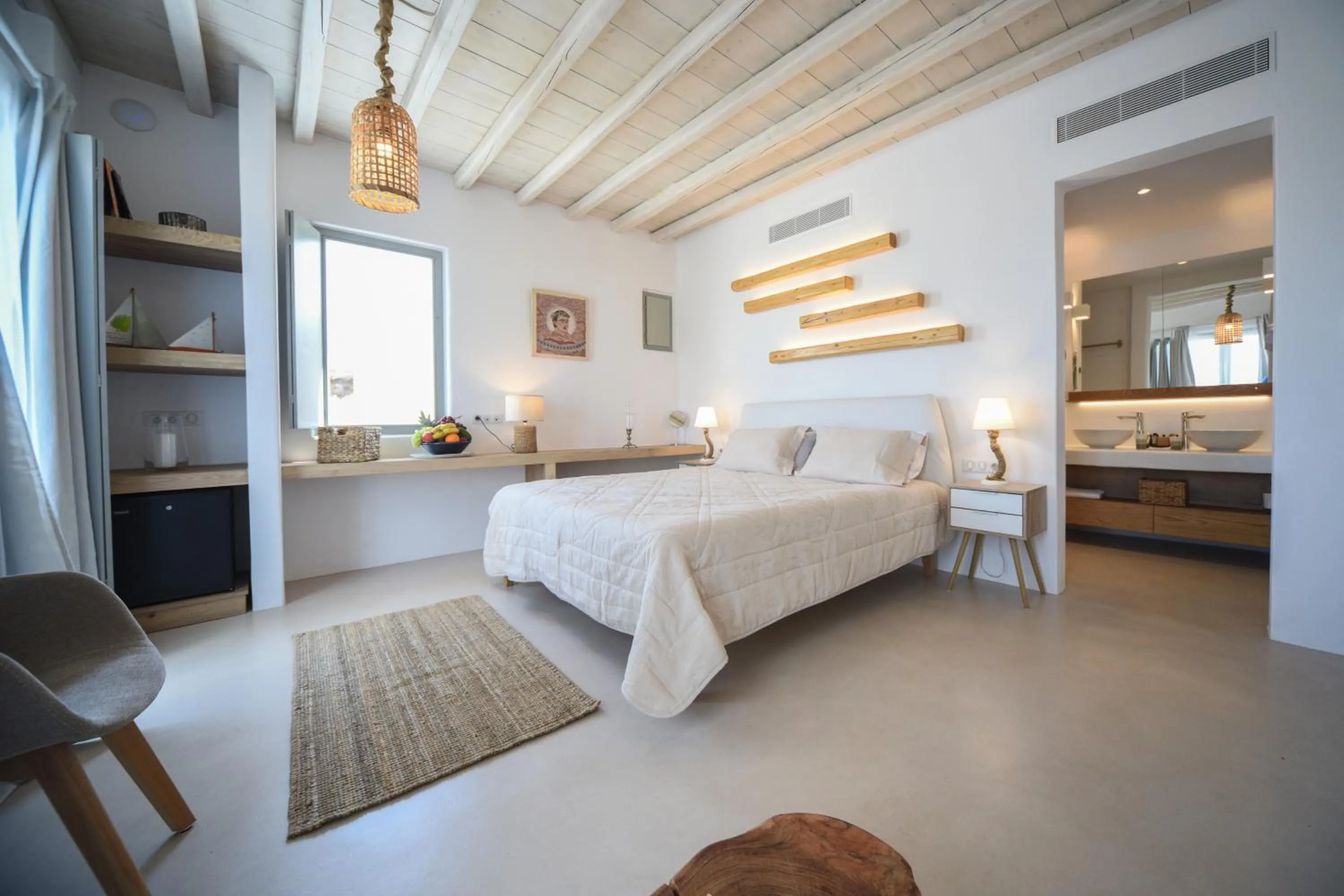 Bed in Myconian Crown Suites