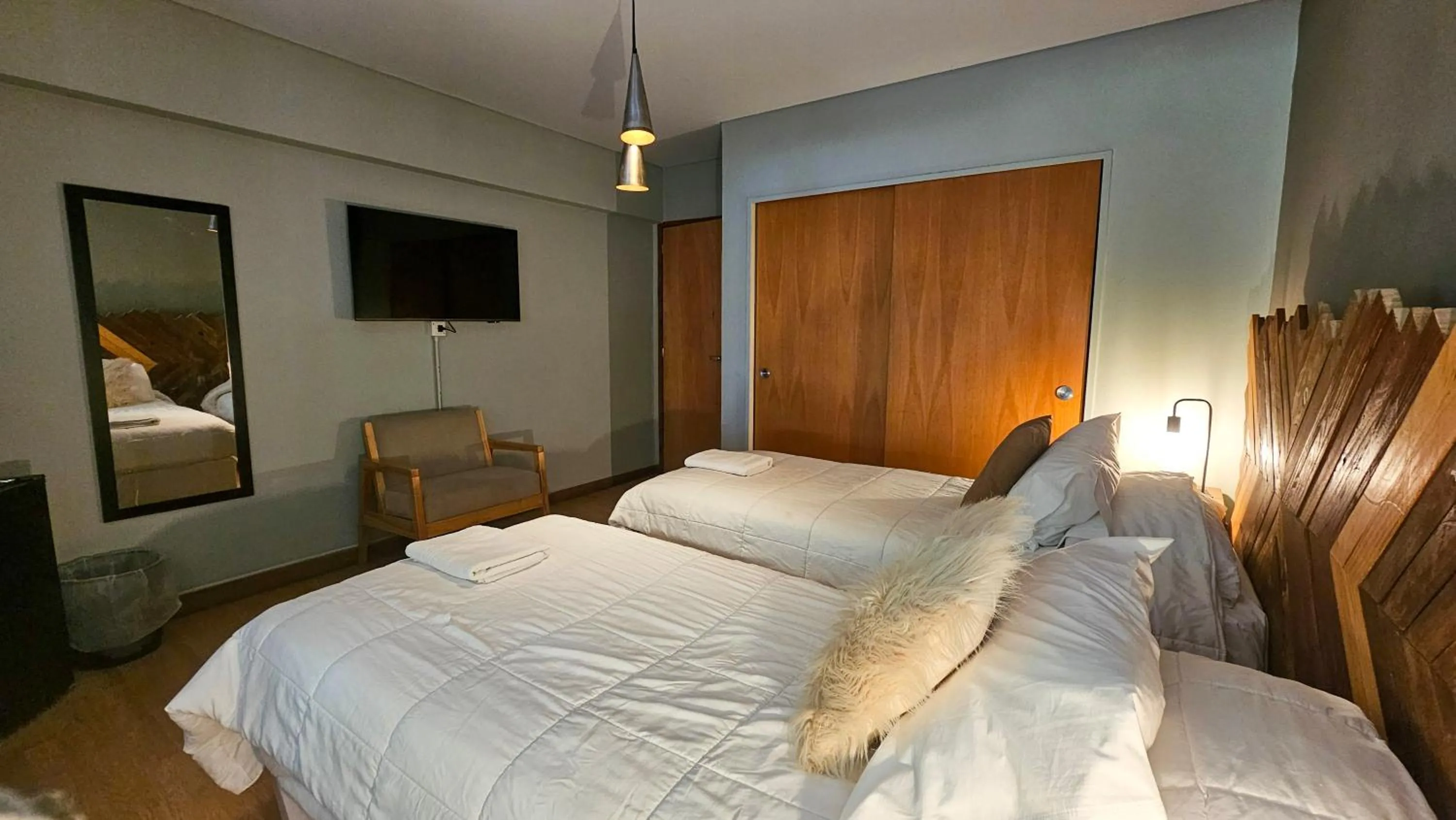 Bedroom, Bed in Pioneros Suites by Grupo Tierra Gaucha