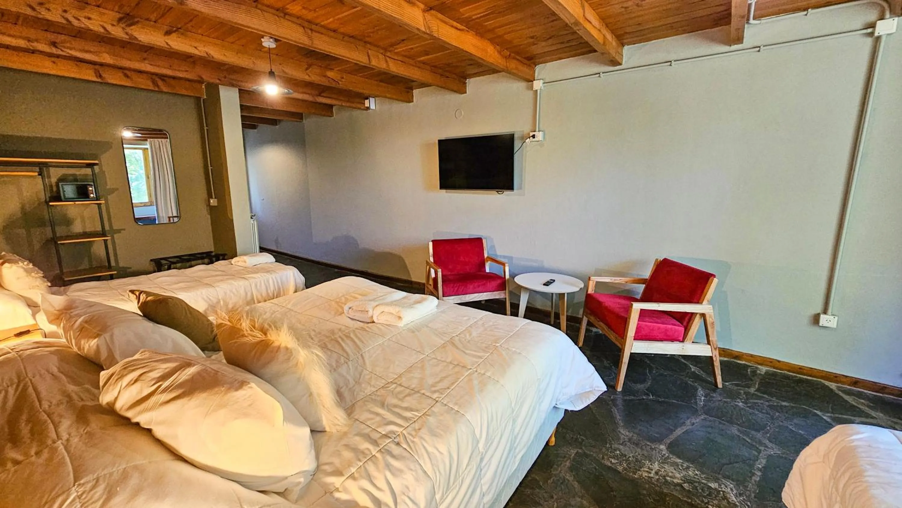 Bedroom, Bed in Pioneros Suites by Grupo Tierra Gaucha