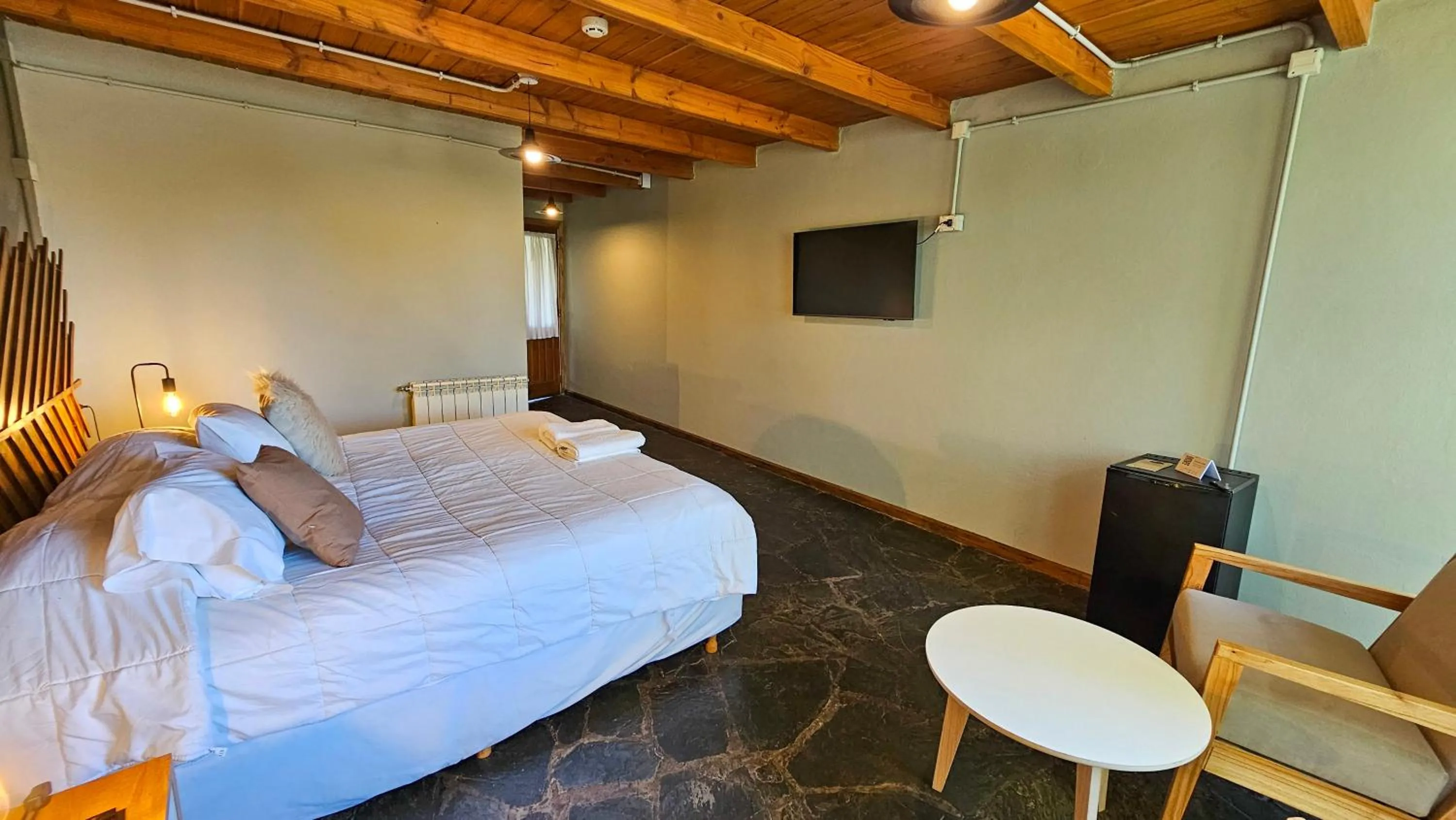 Bedroom, Bed in Pioneros Suites by Grupo Tierra Gaucha