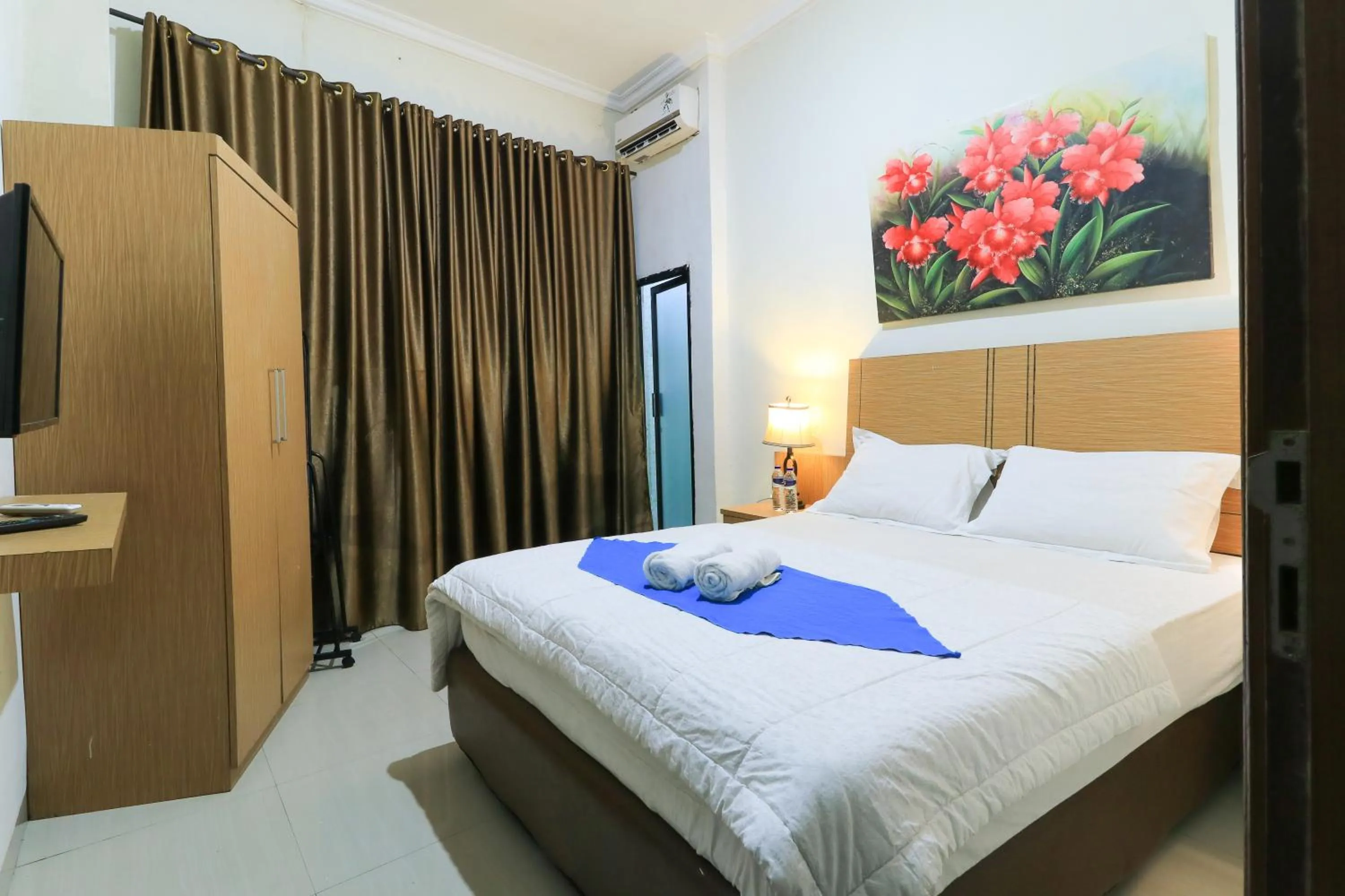 Bed in Labuana Homestay and Cafe Garden Makassar