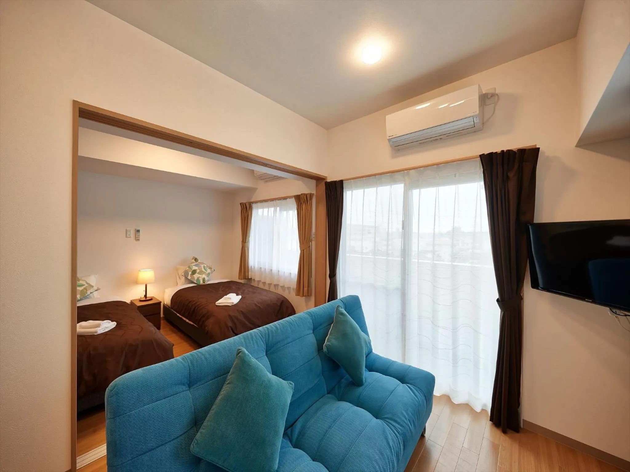 Photo of the whole room, Bed in M´s Stay Okinawa