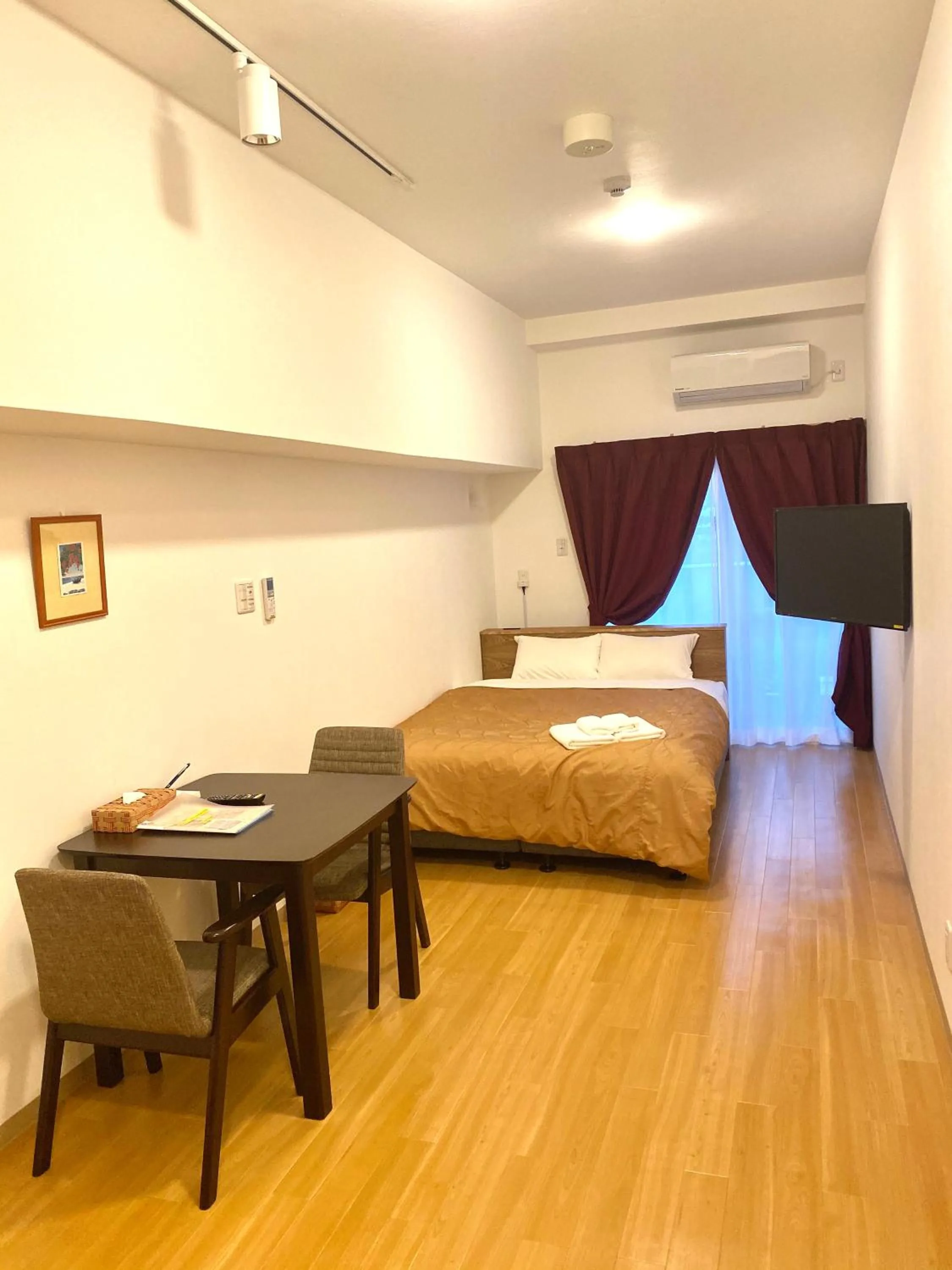 Photo of the whole room, Bed in M´s Stay Okinawa