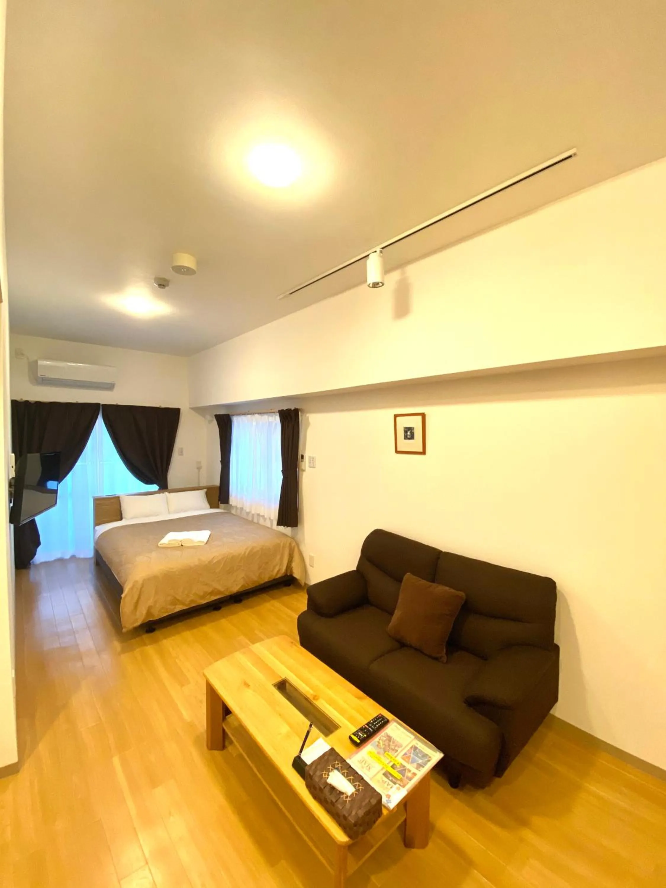 Living room, Bed in M´s Stay Okinawa