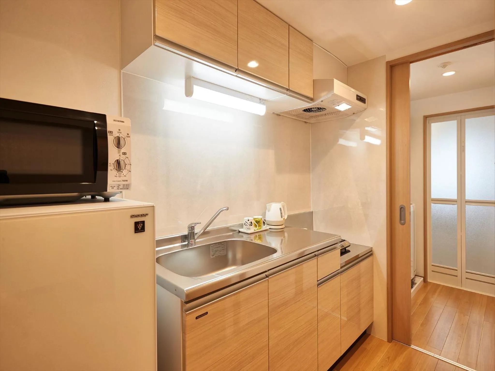 Kitchen or kitchenette in M´s Stay Okinawa