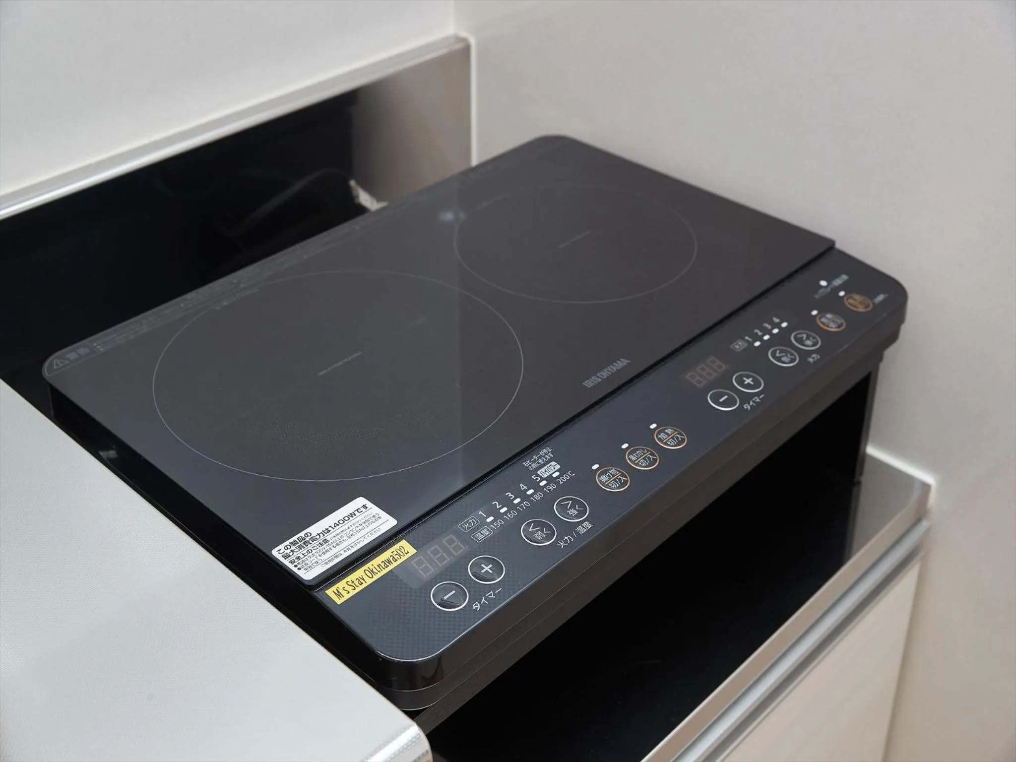 Kitchen or kitchenette in M´s Stay Okinawa