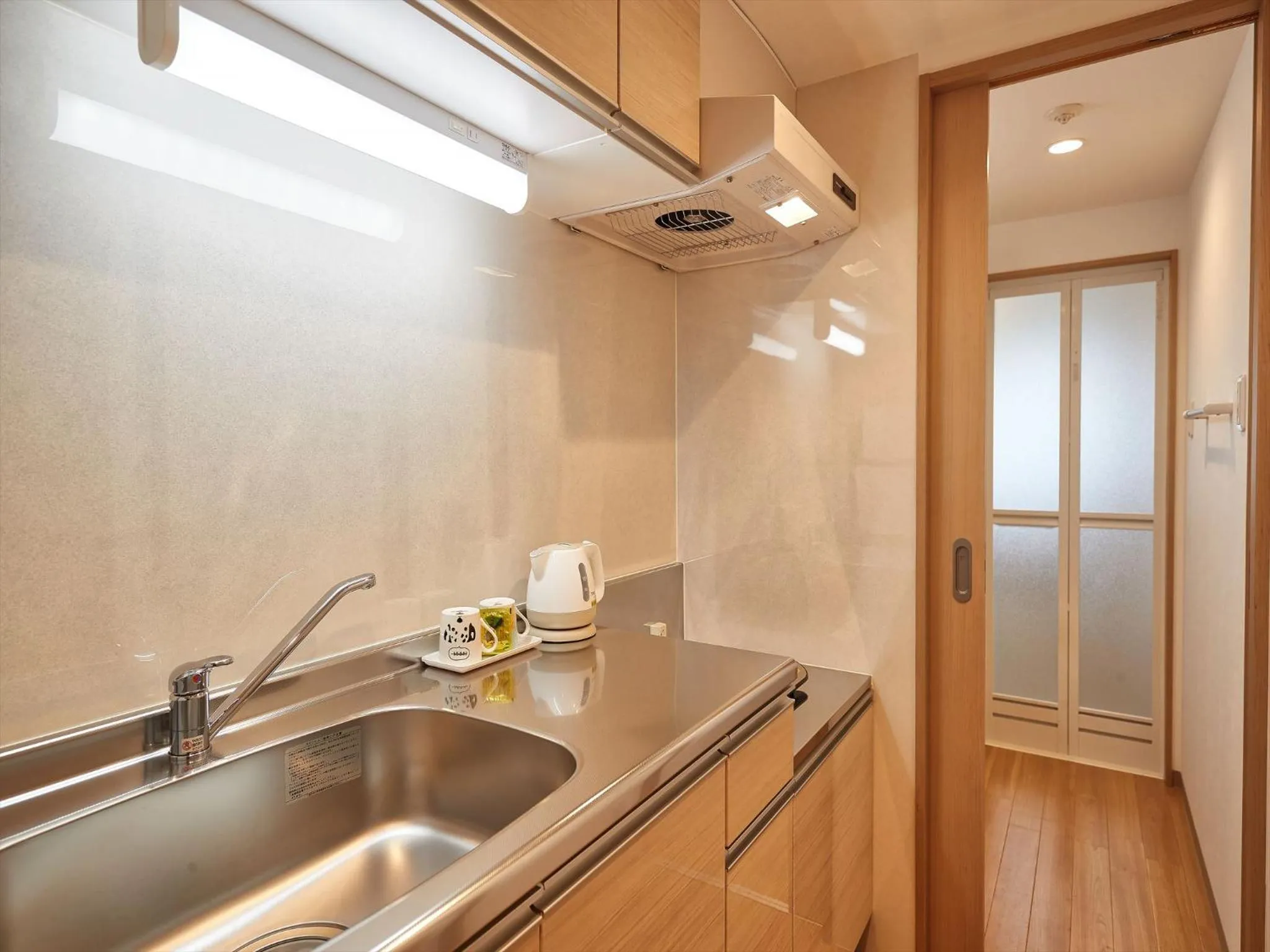 Kitchen or kitchenette in M´s Stay Okinawa