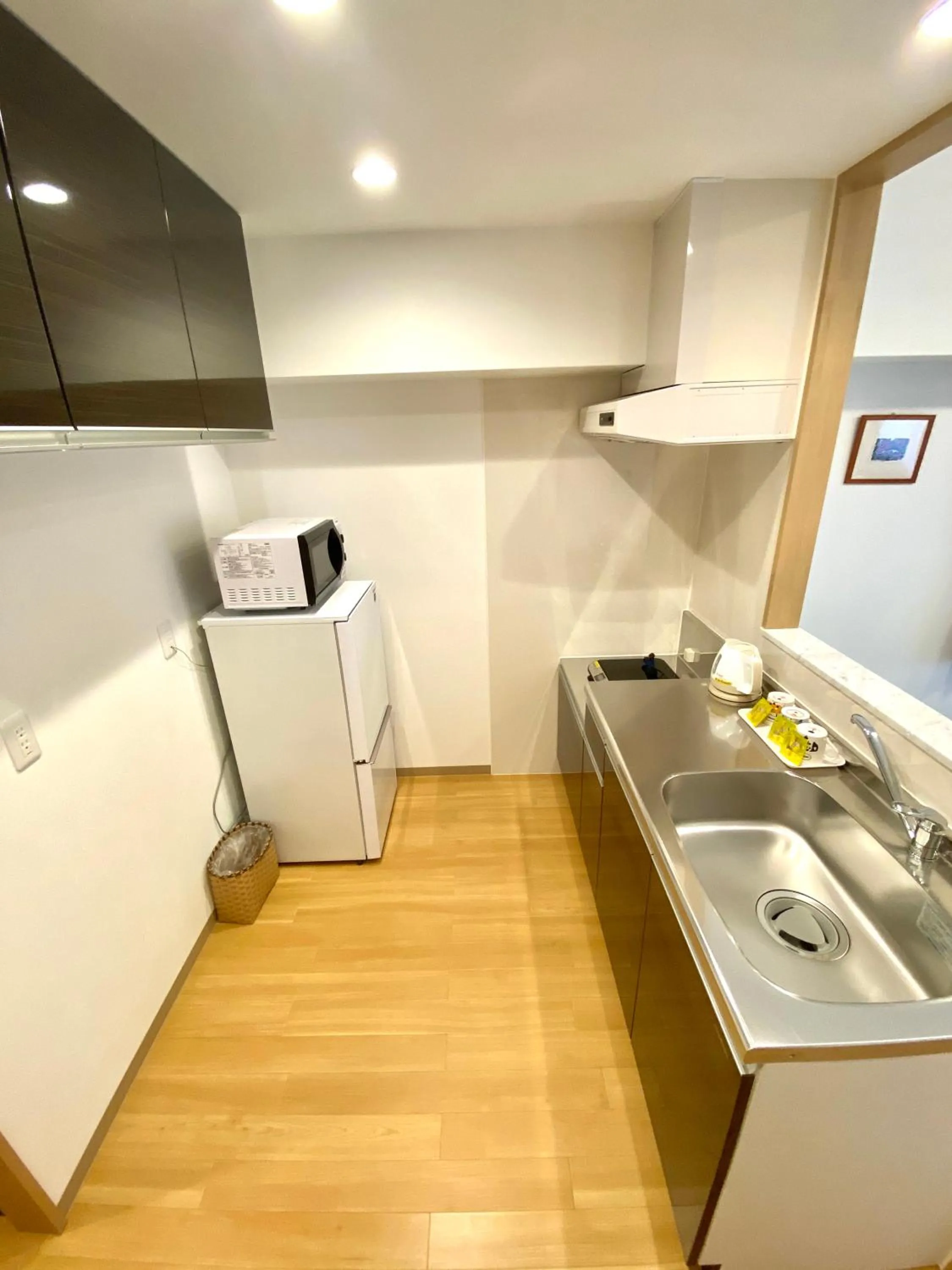 Kitchen or kitchenette in M´s Stay Okinawa