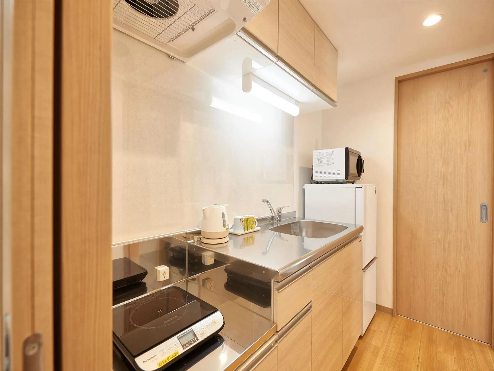 Kitchen or kitchenette in M´s Stay Okinawa