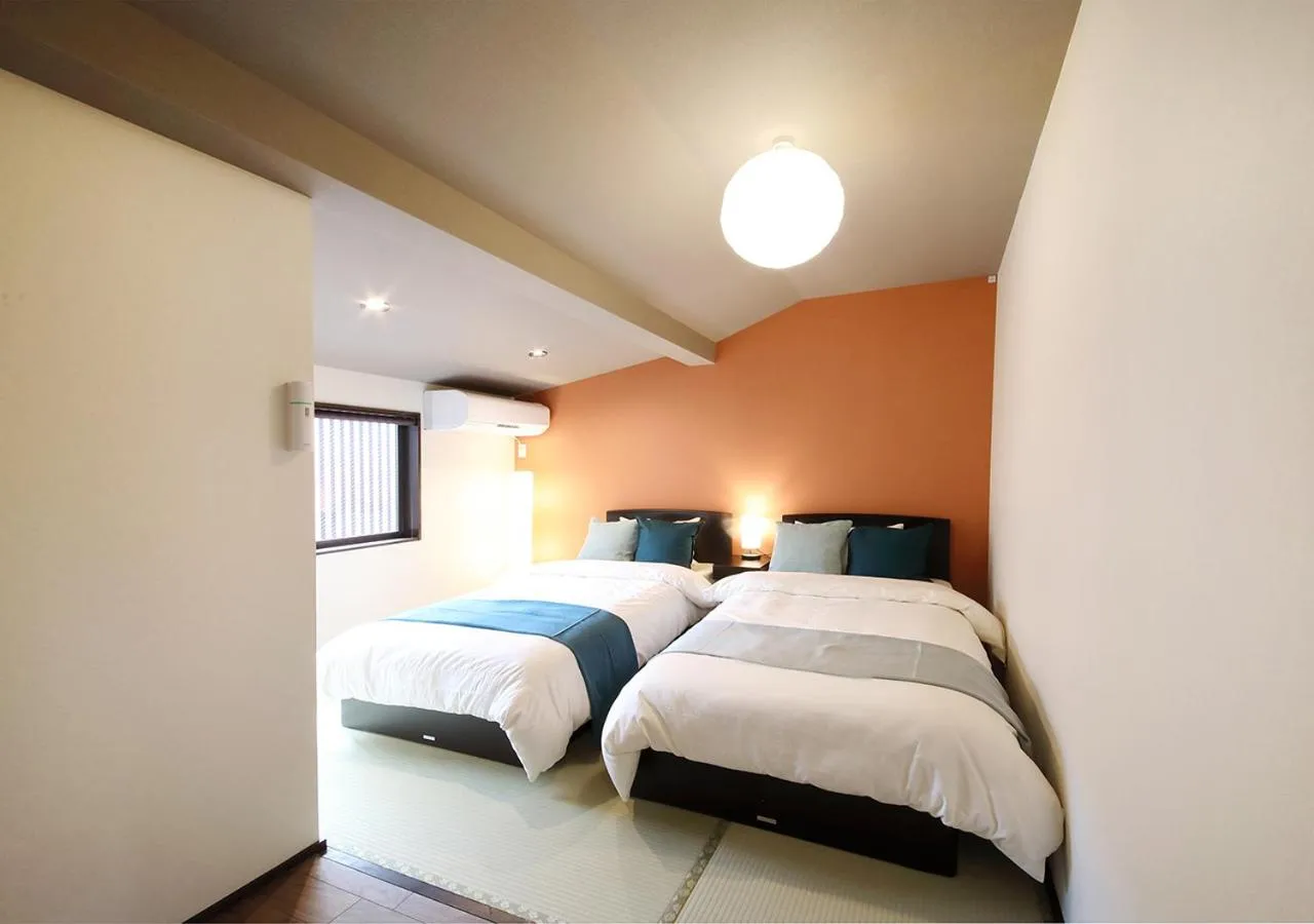 Property building, Bed in Guest House Nishijin Yui