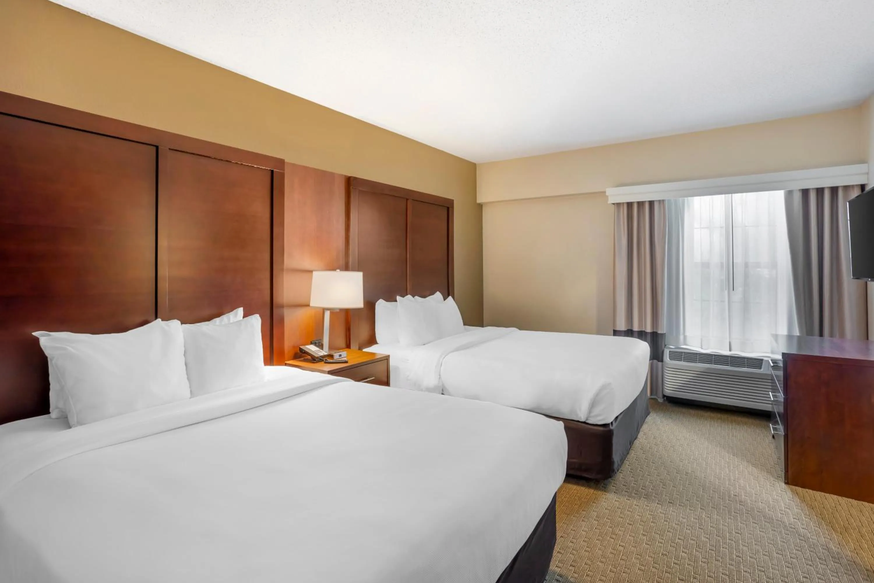 Bed in Comfort Suites State College near Penn State - Steps Away from PSU!