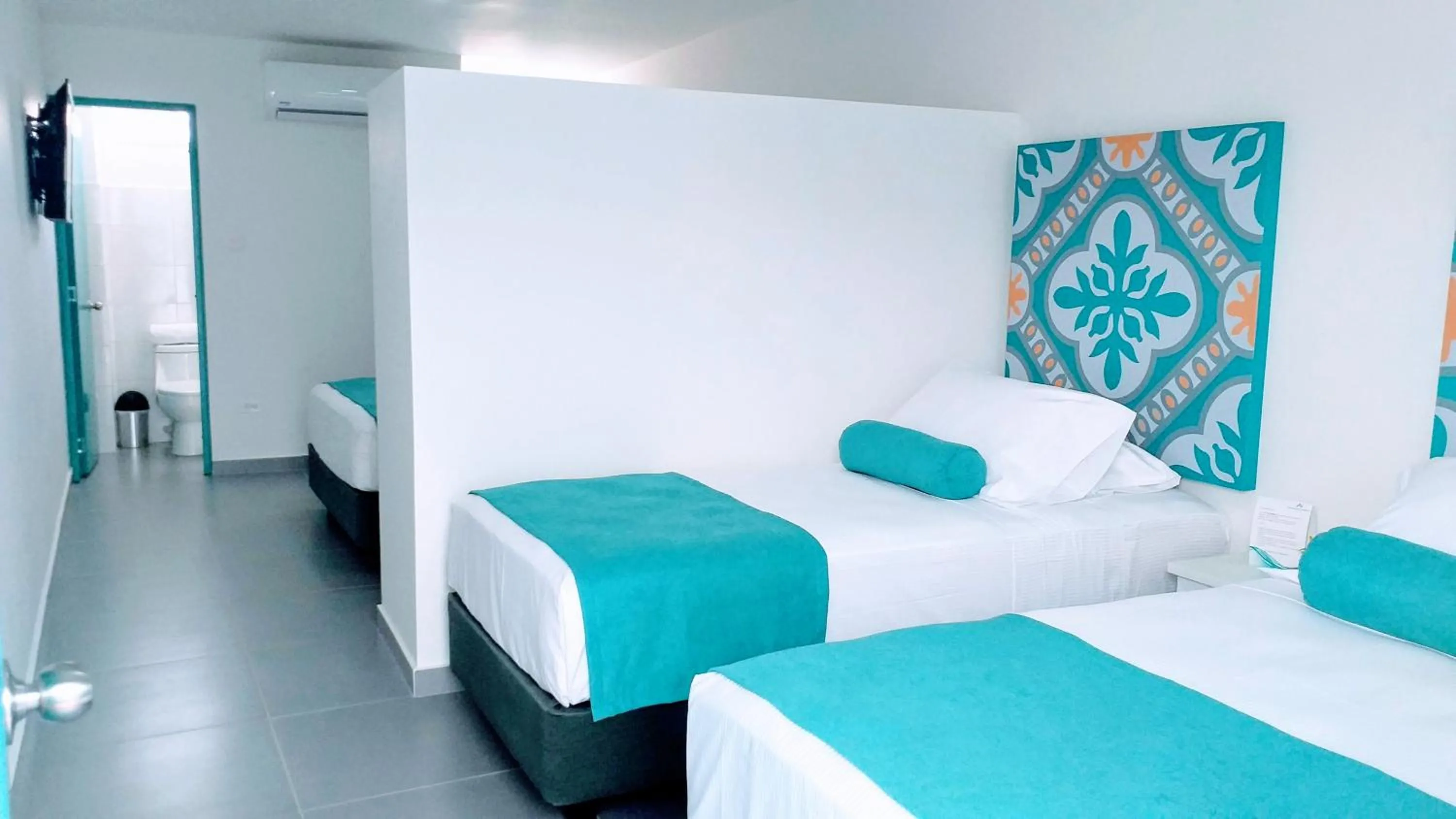 Bed in Akuamarina Hotel