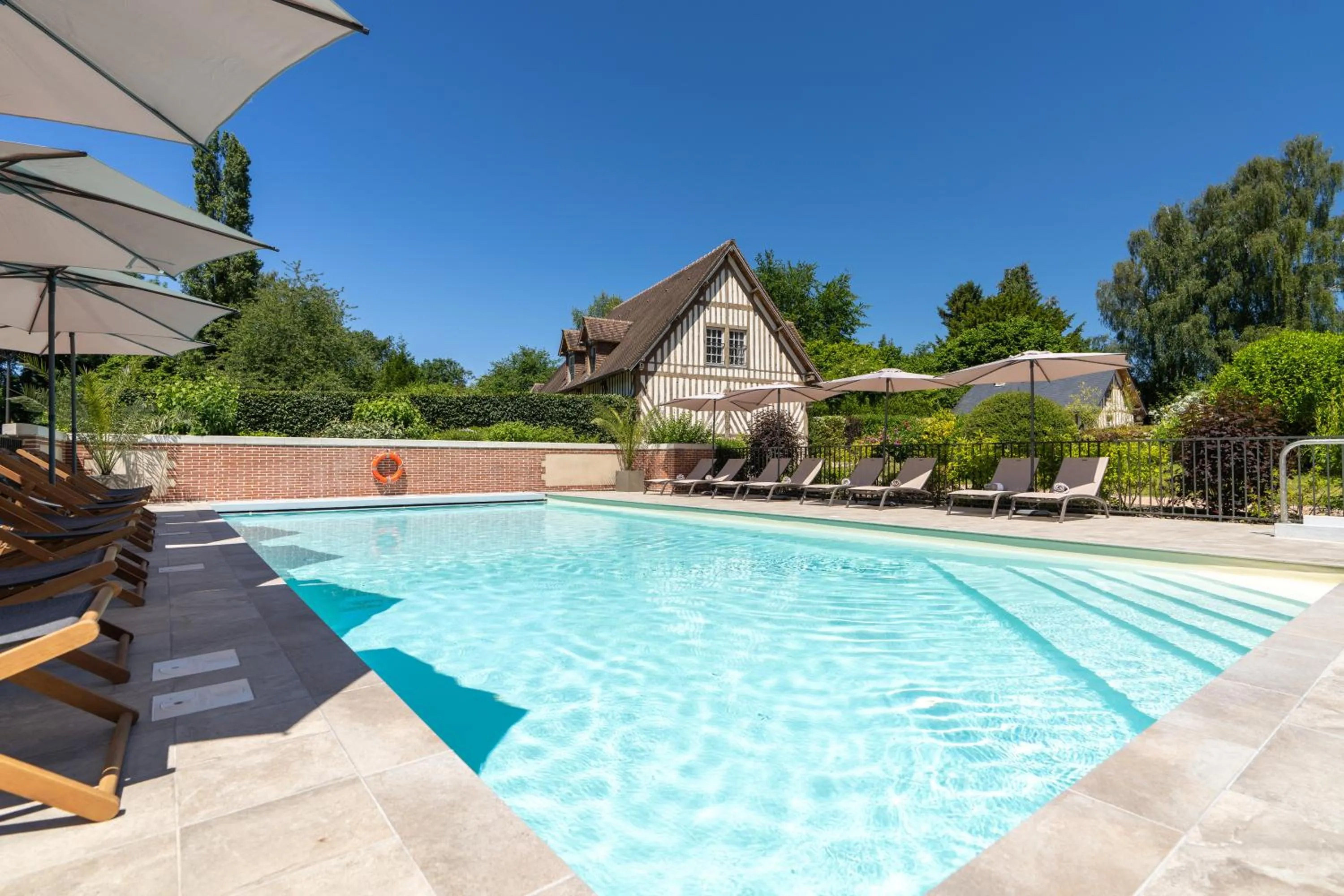 Swimming pool in Les Manoirs des Portes de Deauville - Small Luxury Hotel Of The World