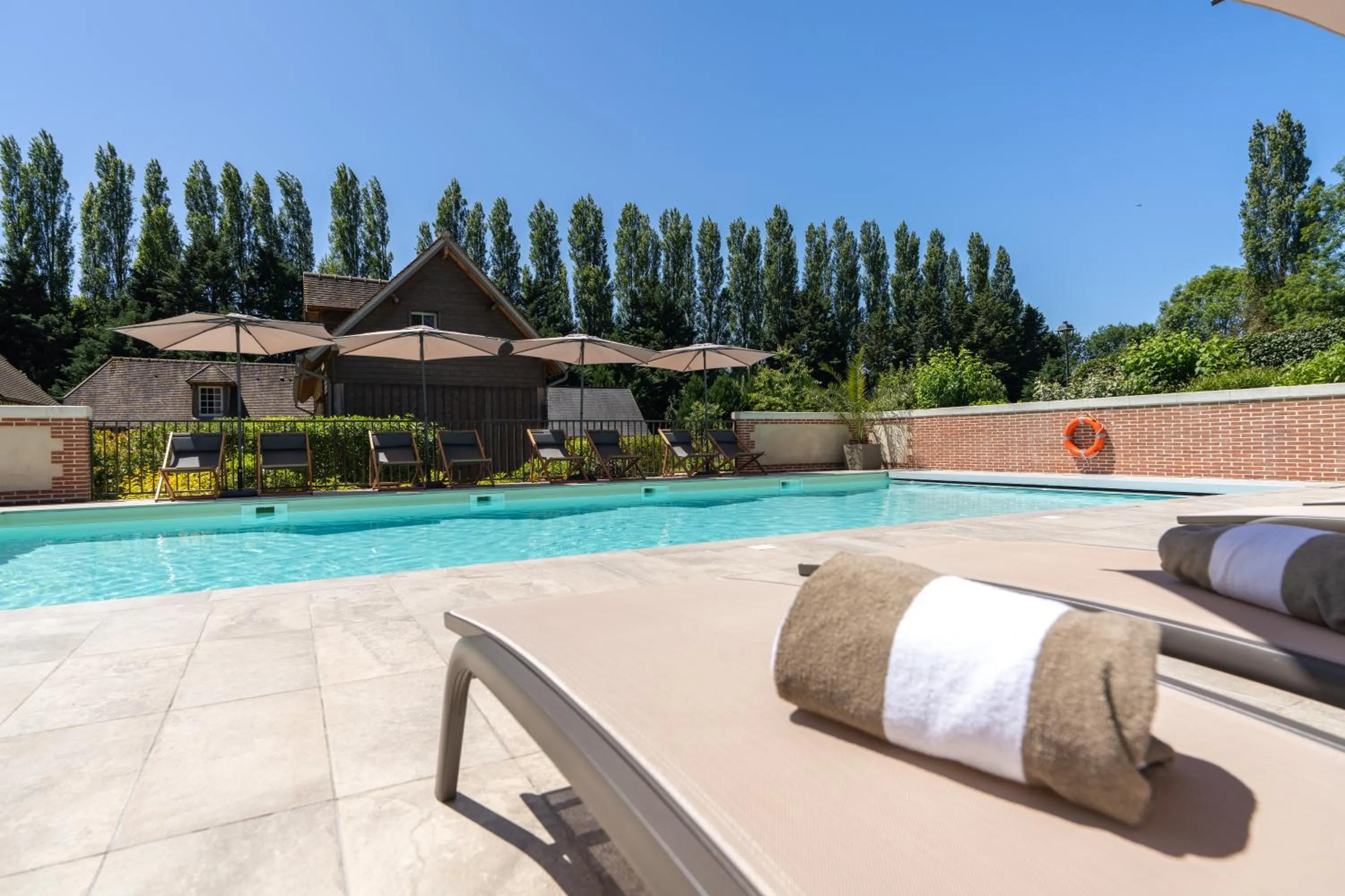 Swimming pool in Les Manoirs des Portes de Deauville - Small Luxury Hotel Of The World